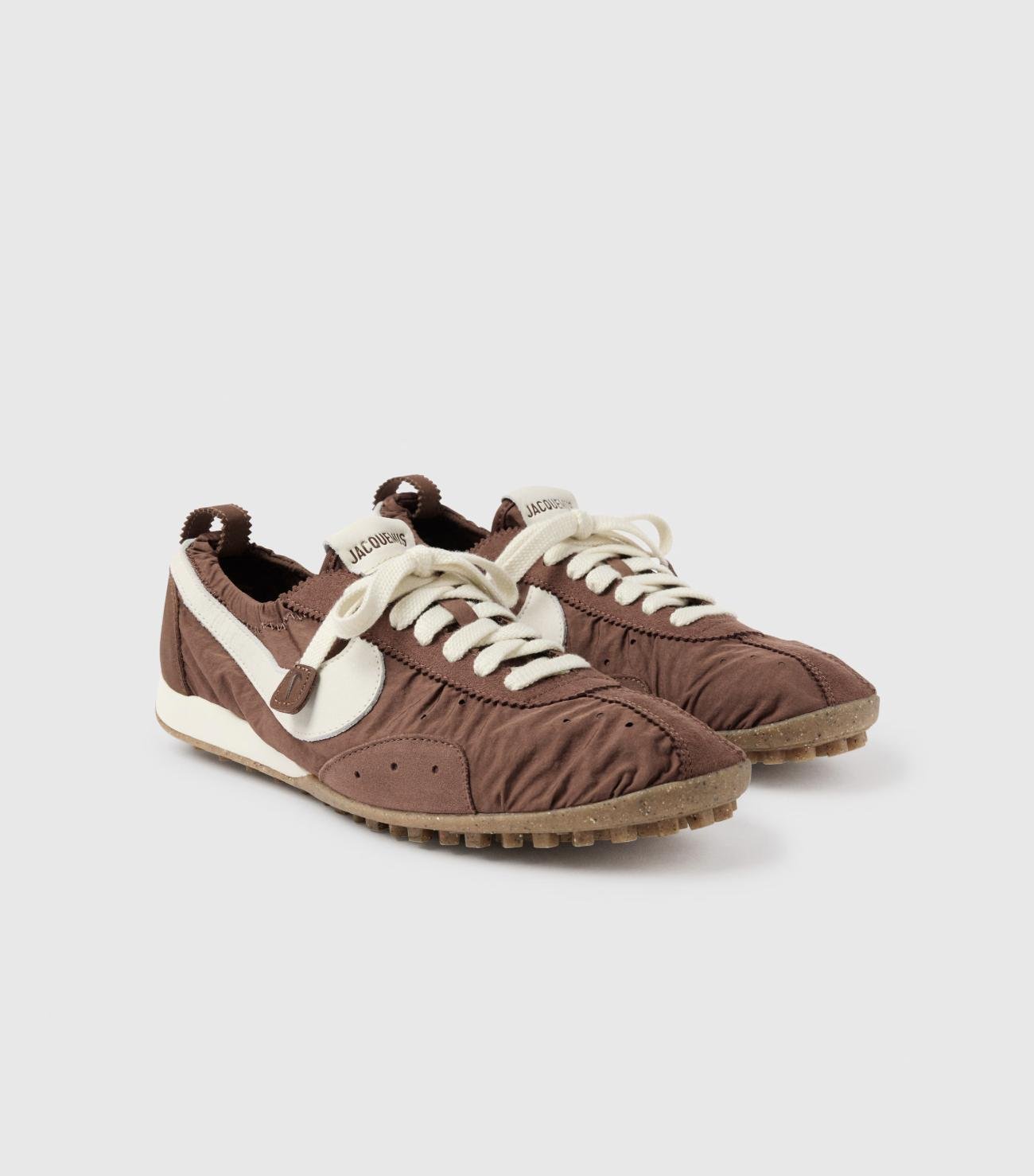 Detail of the Moon Shoe’s crinkled textile, leather Swoosh and waffle outsole.
