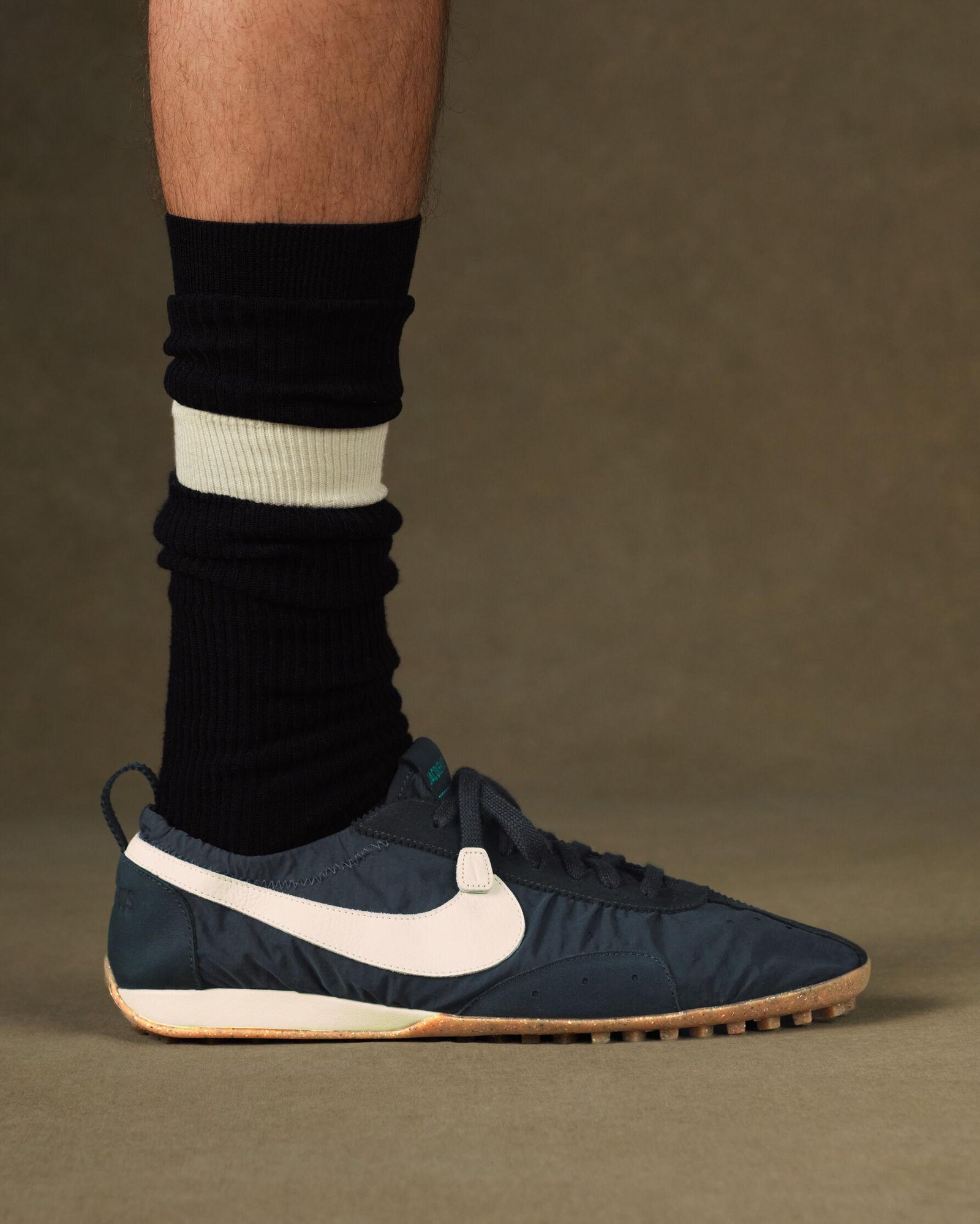 Jacquemus x Nike Moon Shoe shown on foot to illustrate its narrow shape.