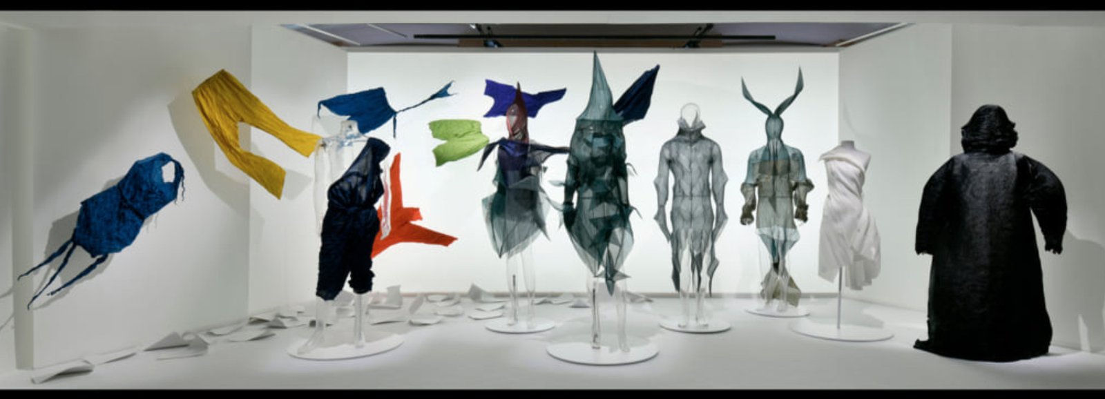 Early Pleats Please Issey Miyake dance costumes displayed in an exhibition