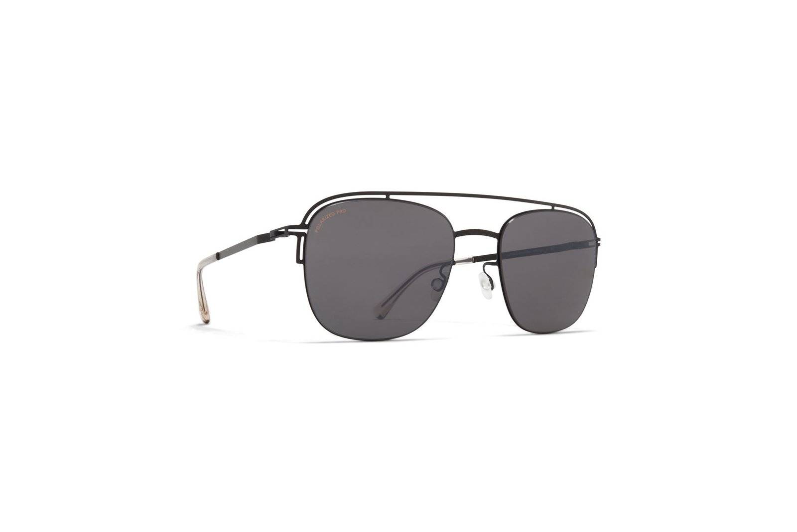 Angled view of MYKITA NOR metal aviator sunglasses with grey lenses.