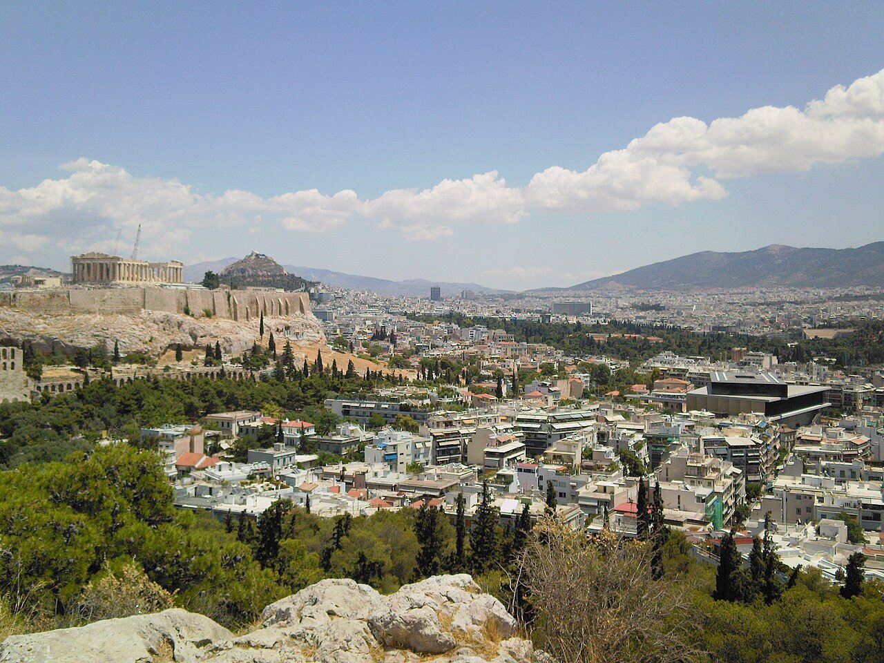 The Acropolis and Acropolis Museum within the Athens cityscape.