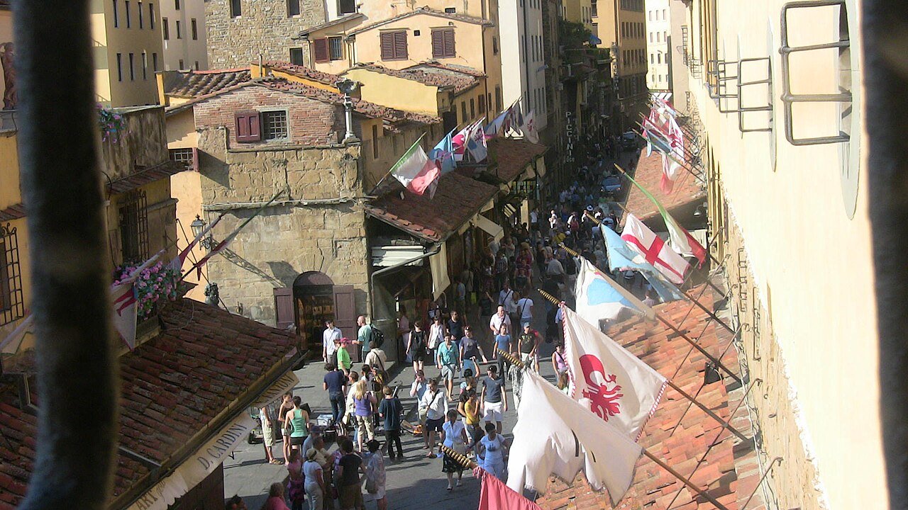 Visitors on Ponte Vecchio viewed from the elevated Vasari Corridor.