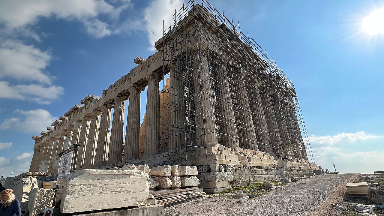 Stone surfaces and walking terrain beside the Parthenon.