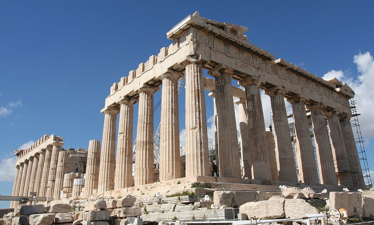 The Parthenon viewed from a permitted walking area beside its columns.