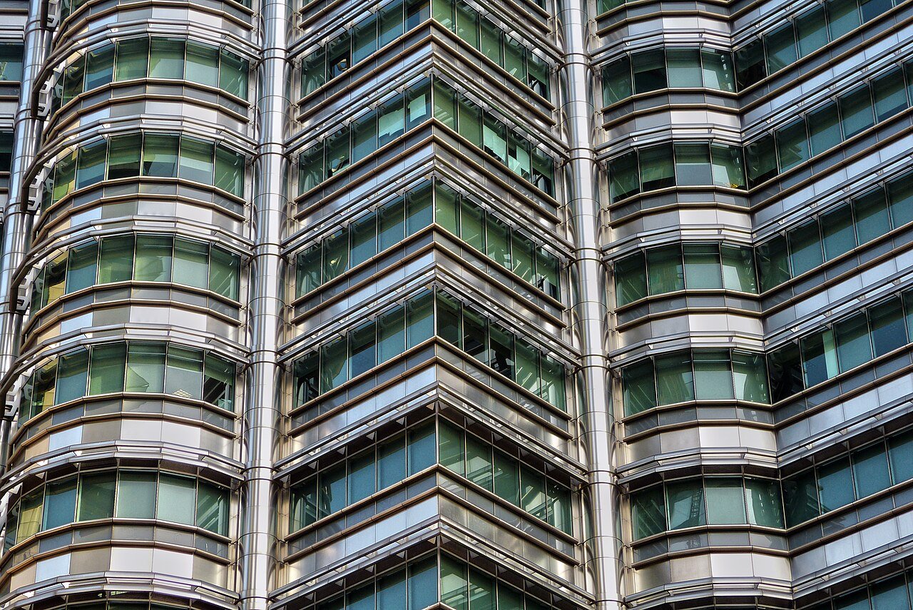 Close-up of the Petronas towers’ stainless-steel and glass facade.