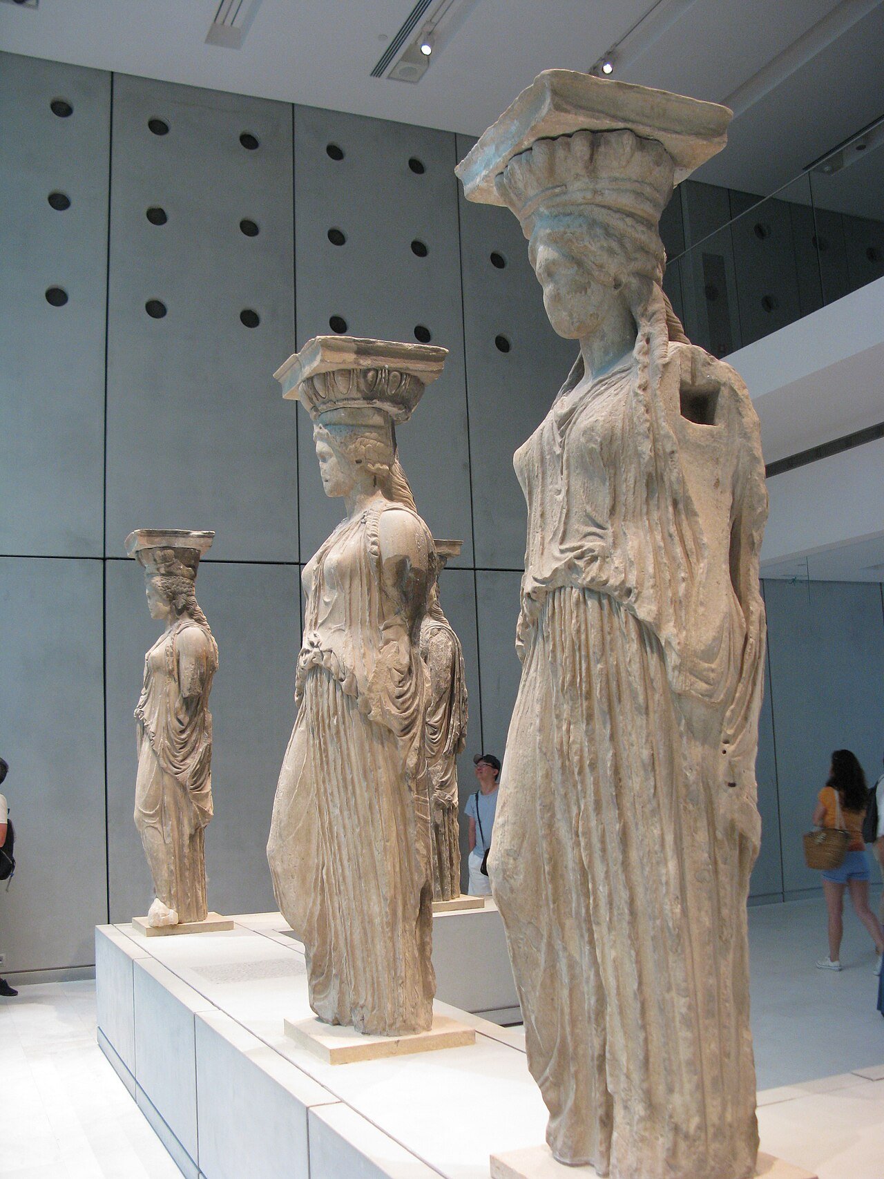 Original Caryatid sculptures displayed inside the Acropolis Museum.