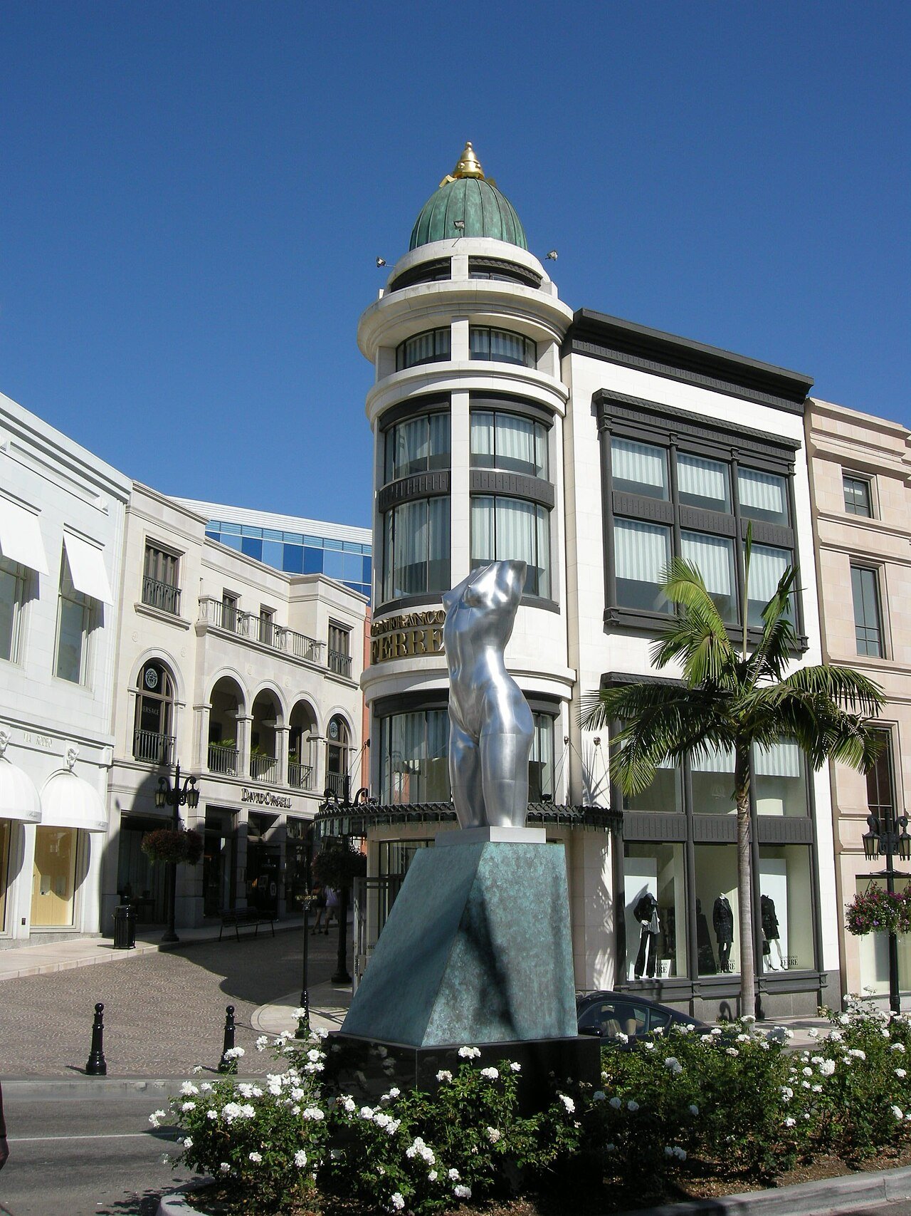 Retail architecture and a sculpture along Rodeo Drive