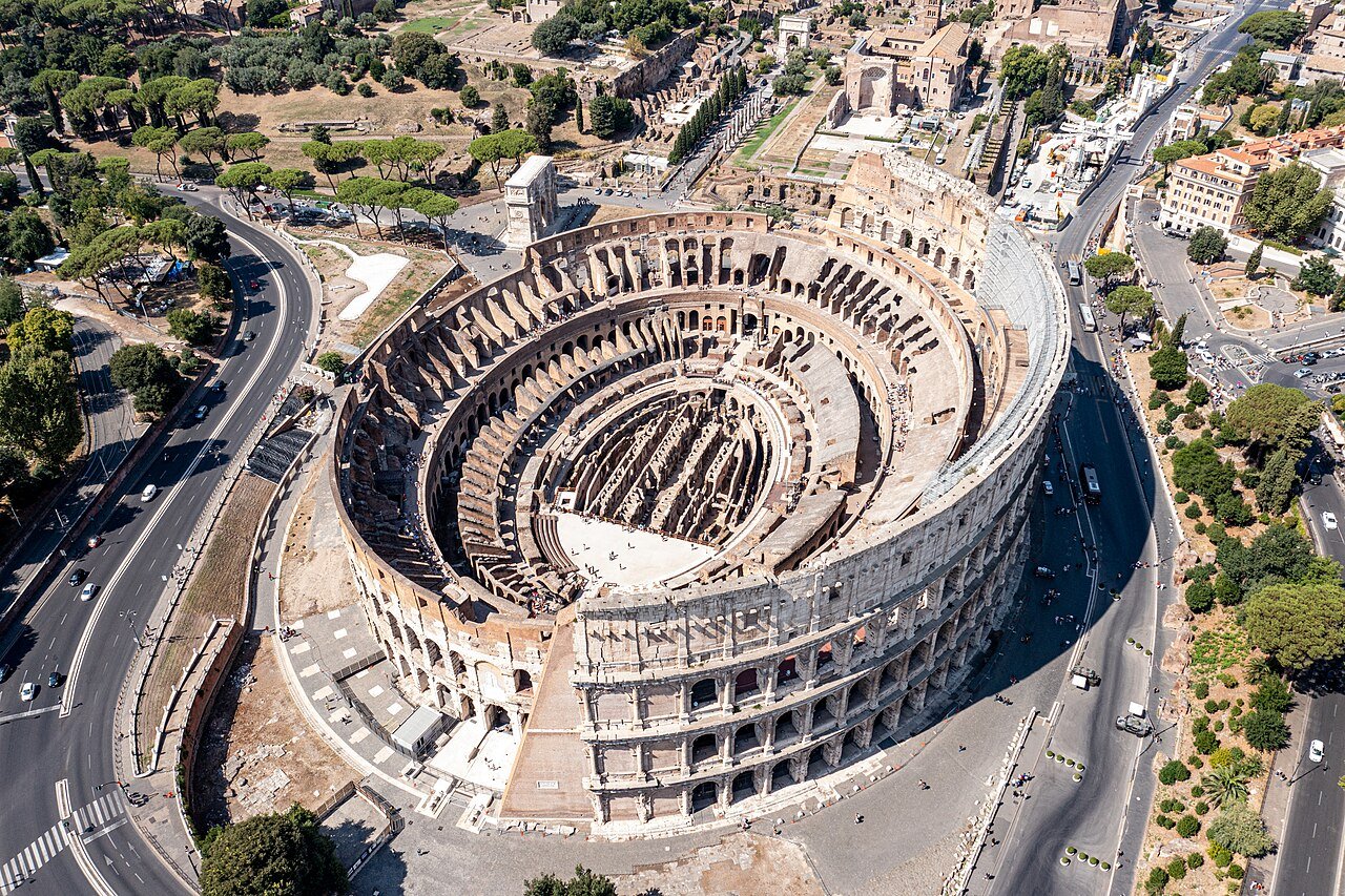 Aerial view showing the Colosseum’s oval plan and exposed interior.