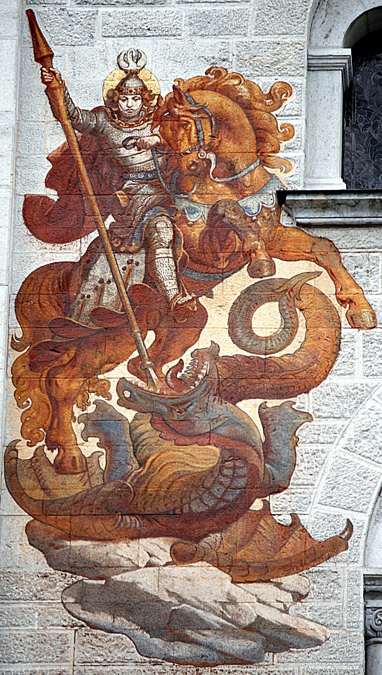Painted knight and dragon on the exterior of Neuschwanstein Castle.