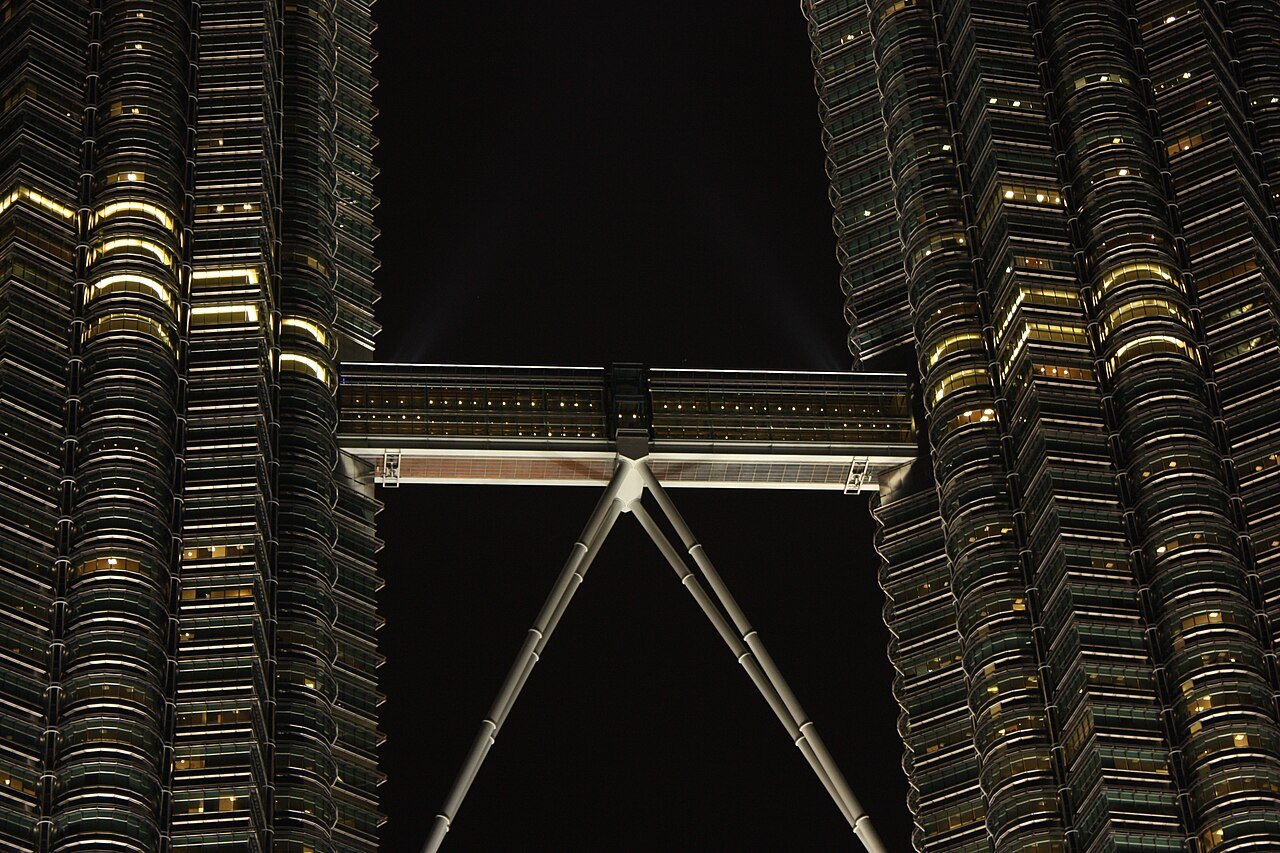 Exterior view of the Skybridge connecting the Petronas Twin Towers at night.
