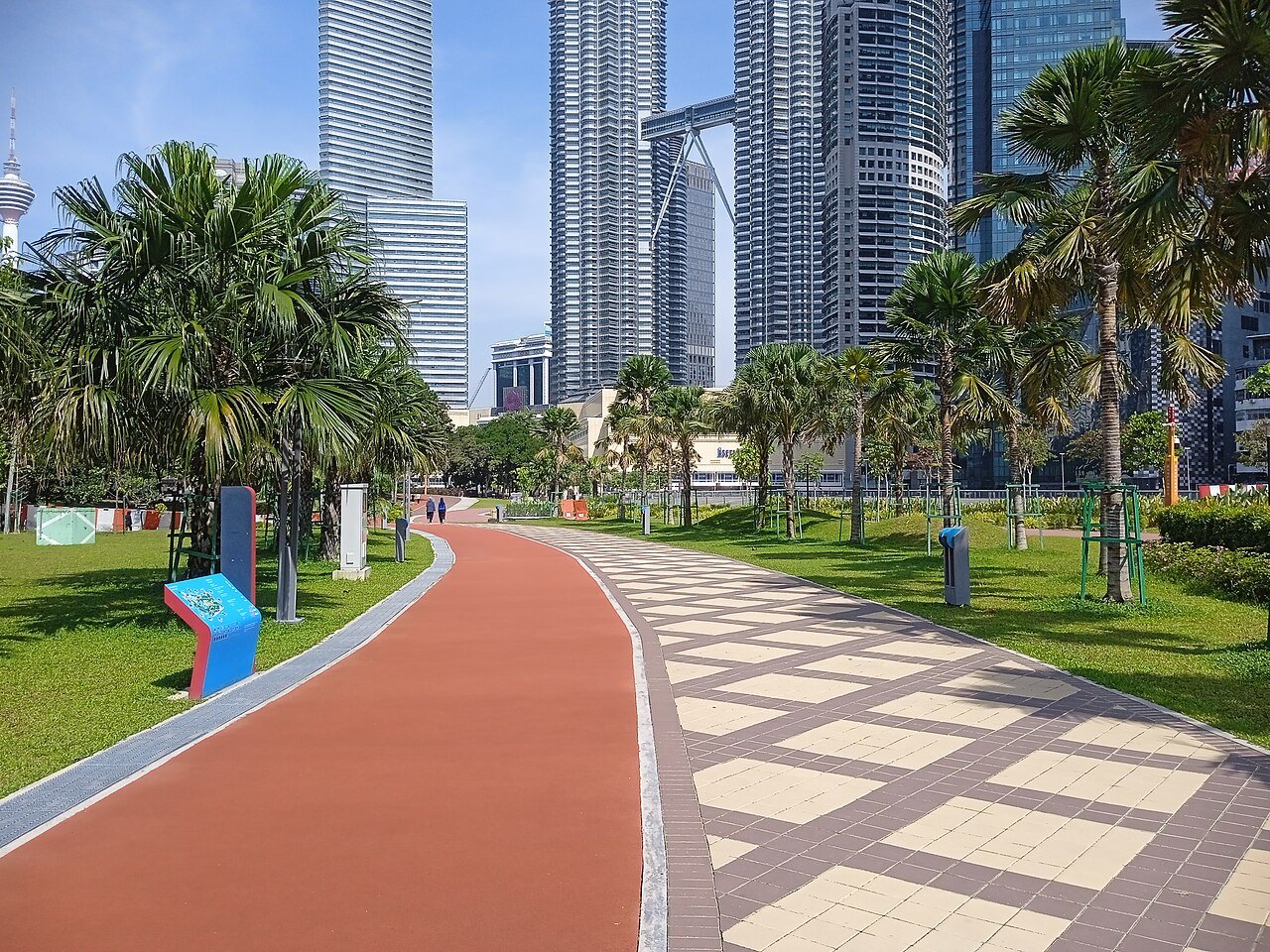 Paved walking and jogging paths through KLCC Park.