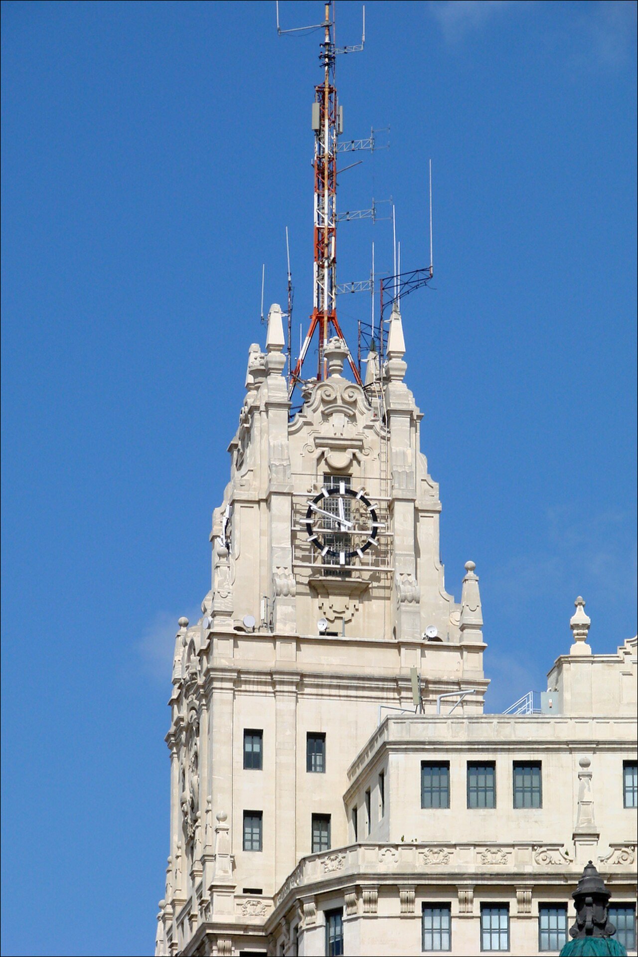 Upper tower and sculptural details of Madrid’s Telefónica building.