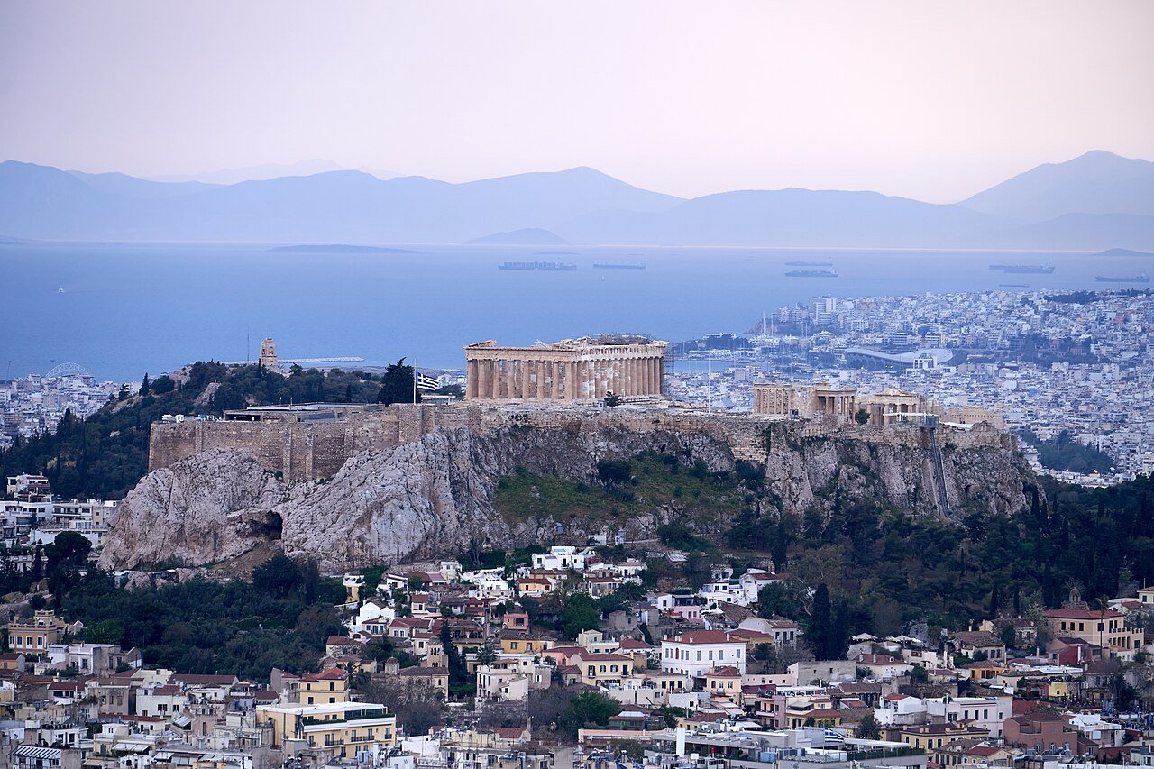 The Acropolis viewed across Athens in soft evening light.