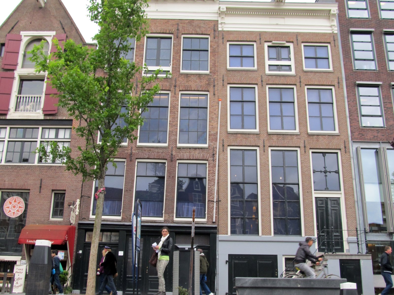 Visitors outside the historic façade of the Anne Frank House.