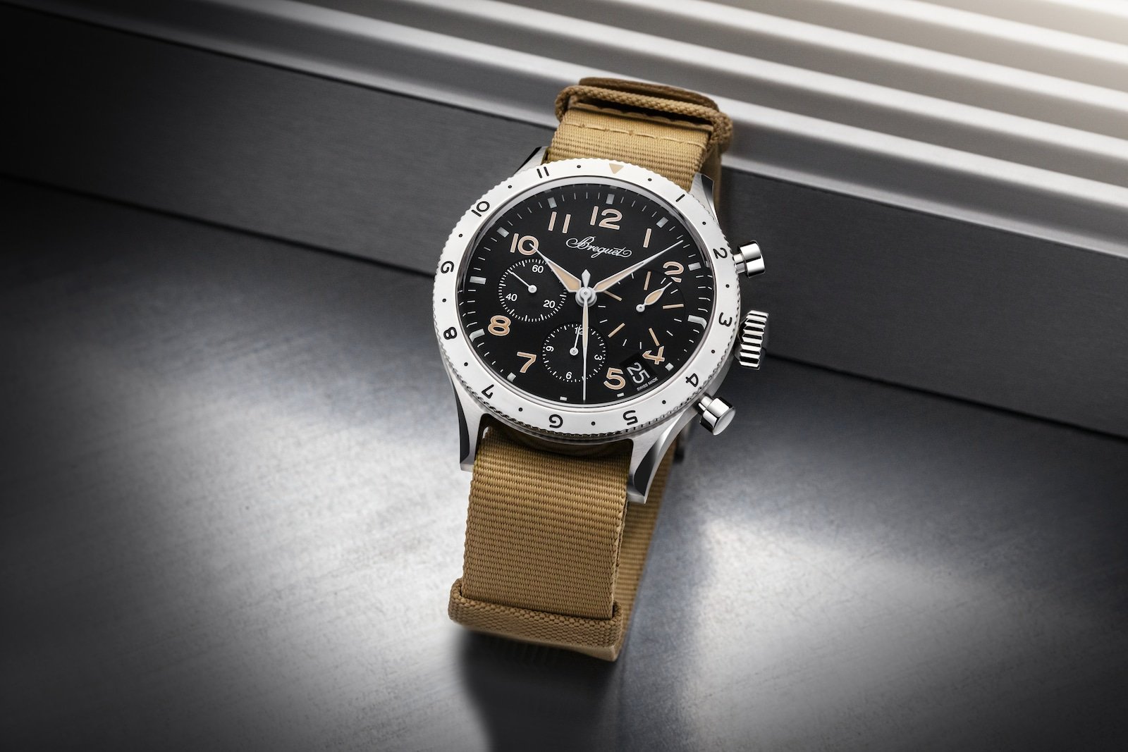 Steel Breguet Type XX chronograph displayed on a tan leather strap.