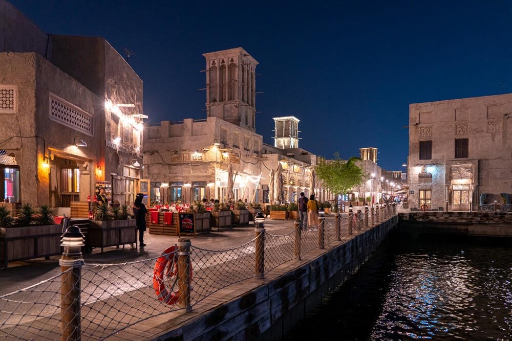 Illuminated Al Seef waterfront promenade after dark