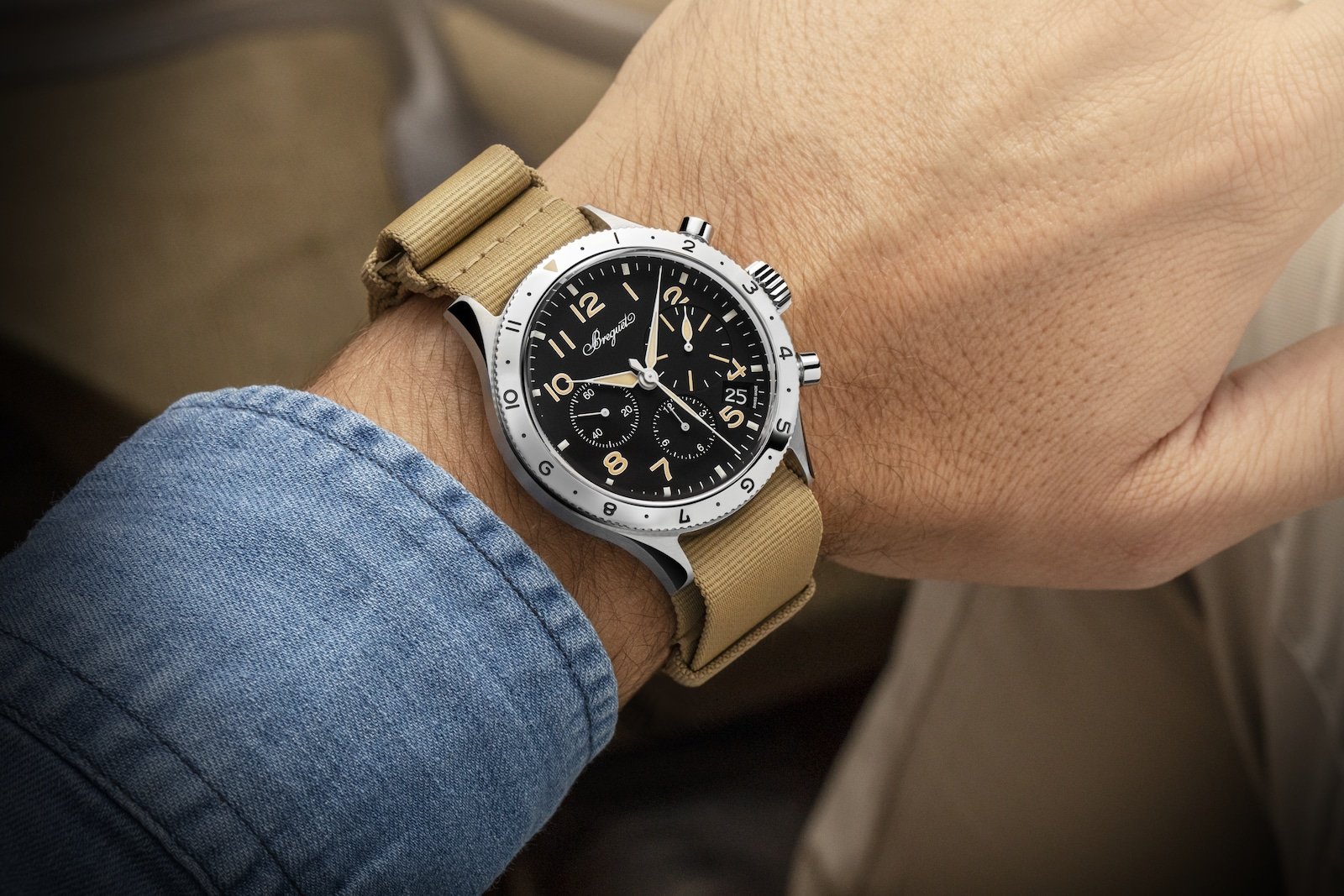 Steel Breguet Type XX chronograph worn on the wrist with a shirt sleeve.