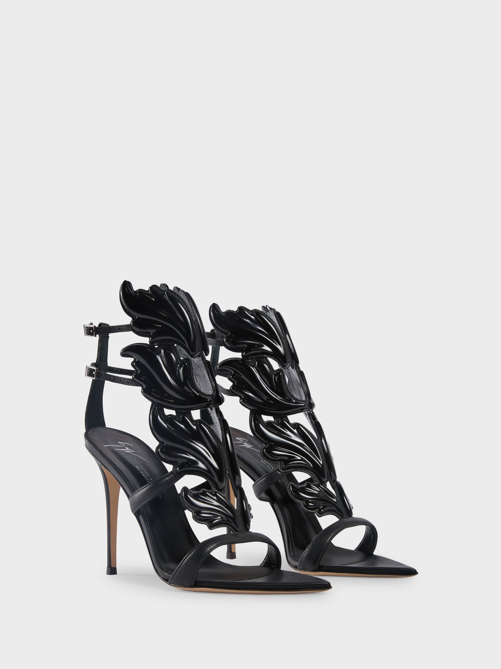 Black Giuseppe Zanotti New Cruel sandals with sculptural metal detailing.