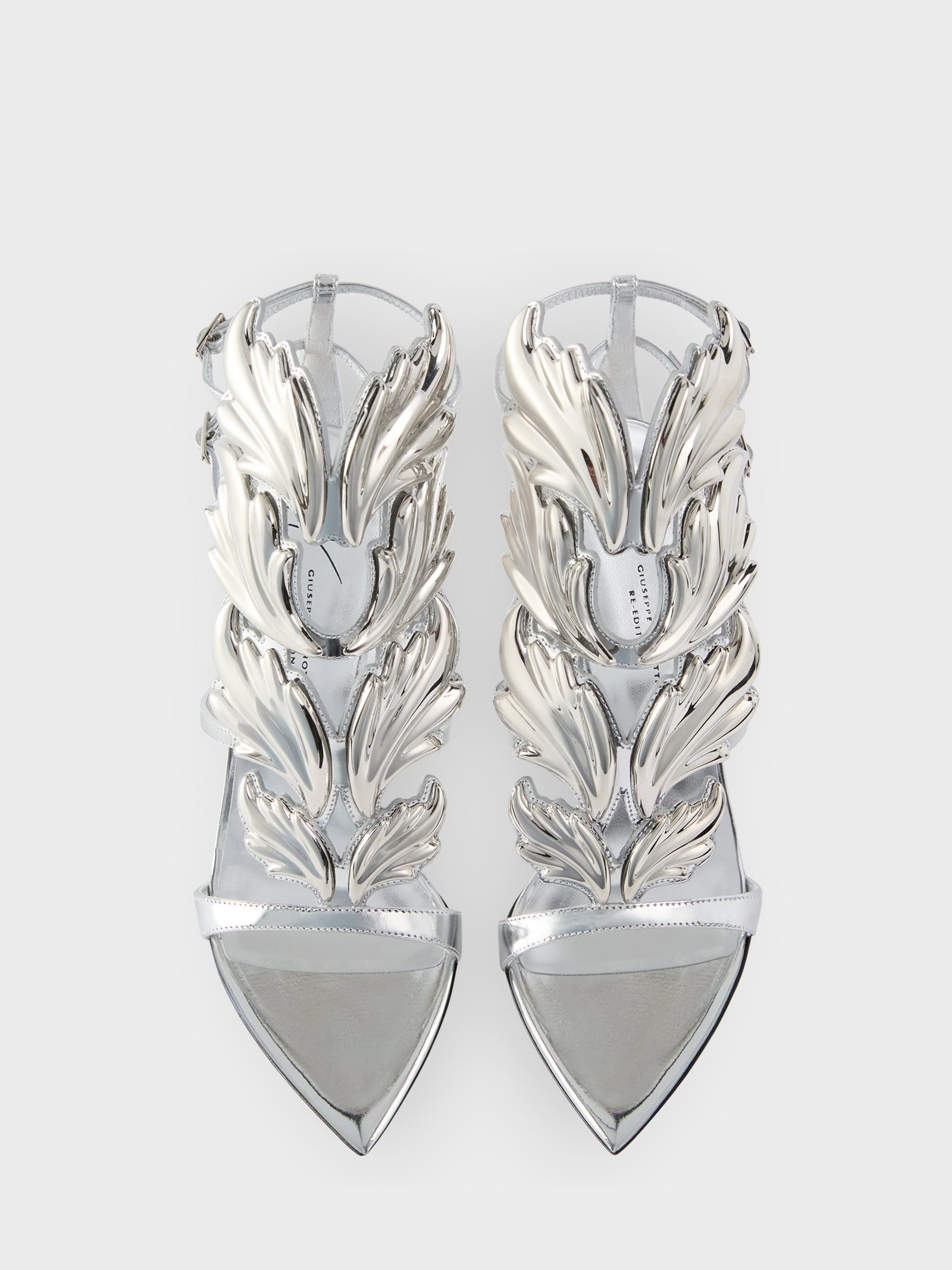 Silver leather Giuseppe Zanotti New Cruel sandals with sculptural metal ornaments.