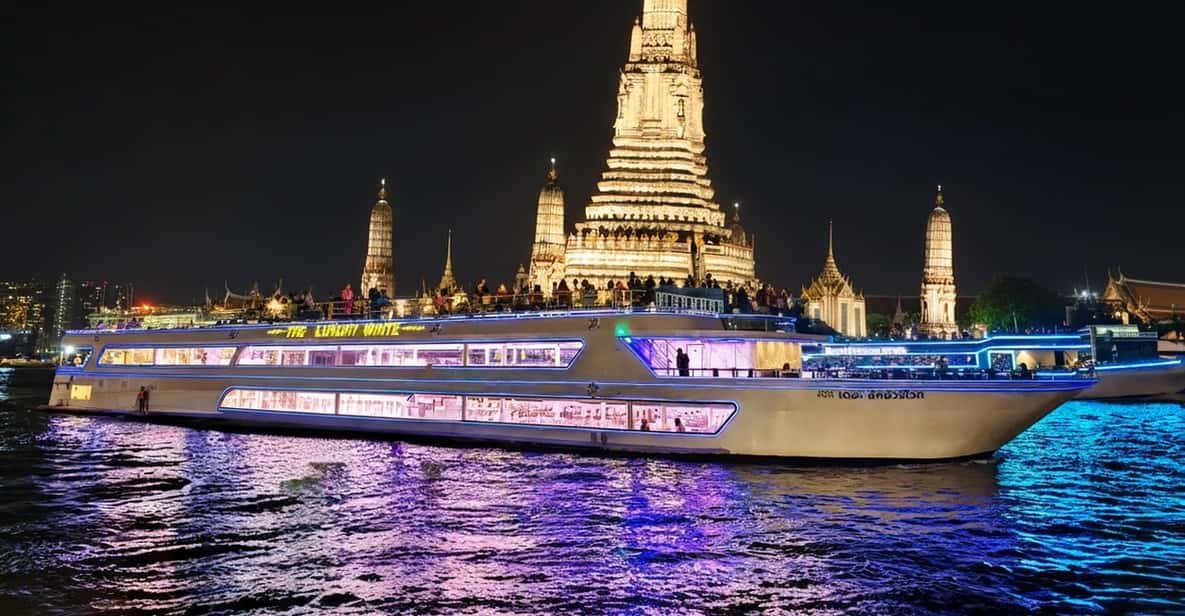 A dinner boat travelling along Bangkok’s illuminated riverfront.