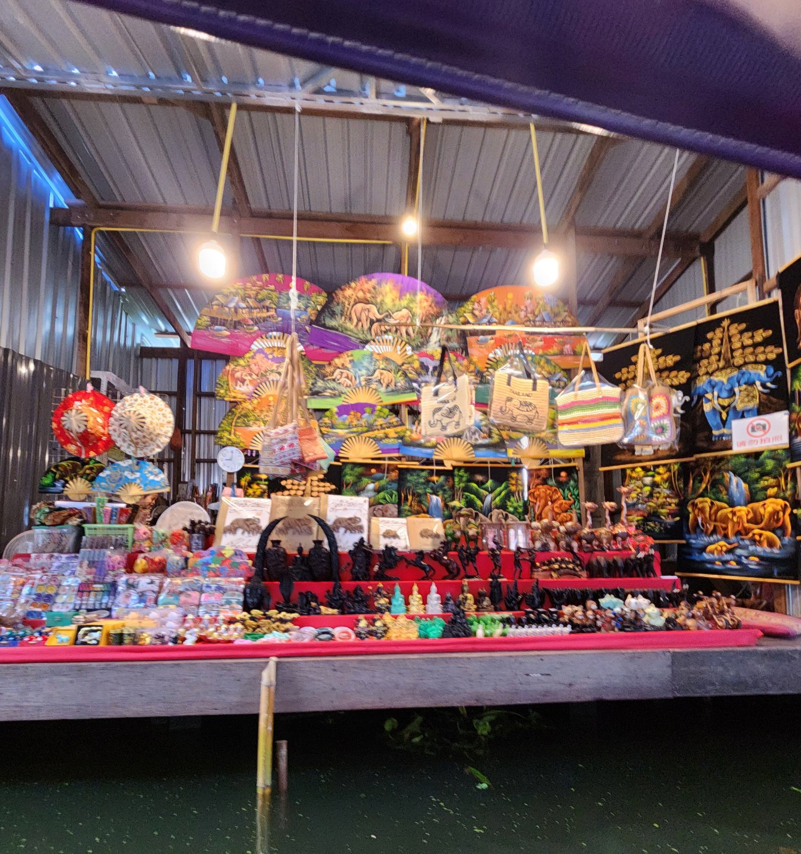 Souvenir stall viewed from a boat at Damnoen Saduak.