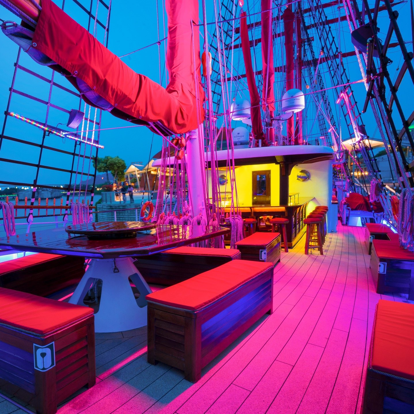 Evening seating and tables on the open deck of Royal Albatross