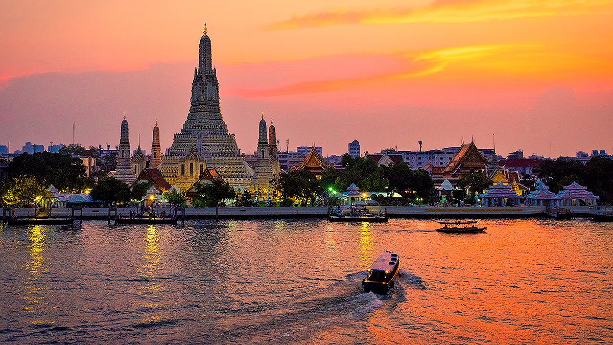Wat Arun beside the Chao Phraya River in Bangkok.