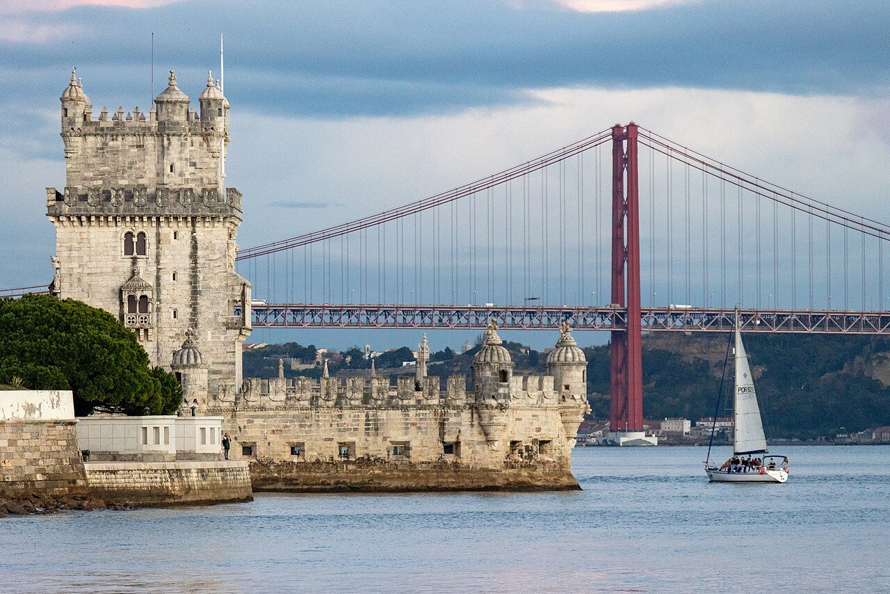Belém Tower with the 25 de Abril Bridge in the distance.