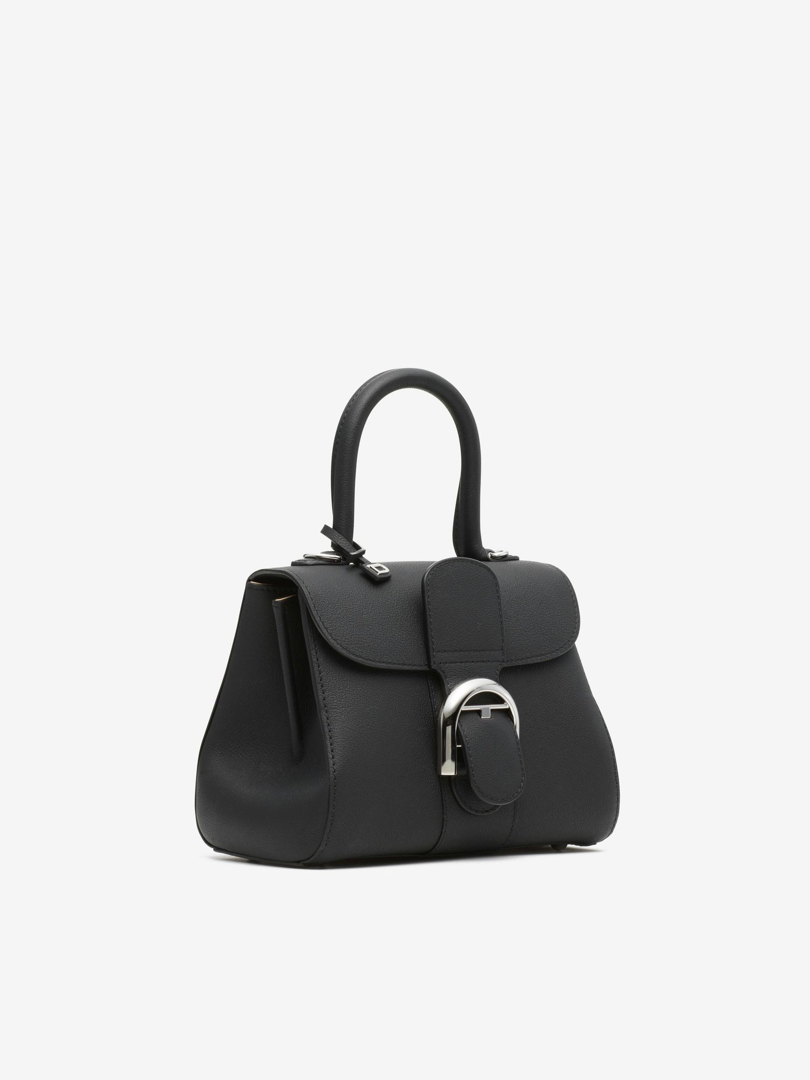 Black Delvaux Brillant Mini showing its structured shape and palladium buckle.