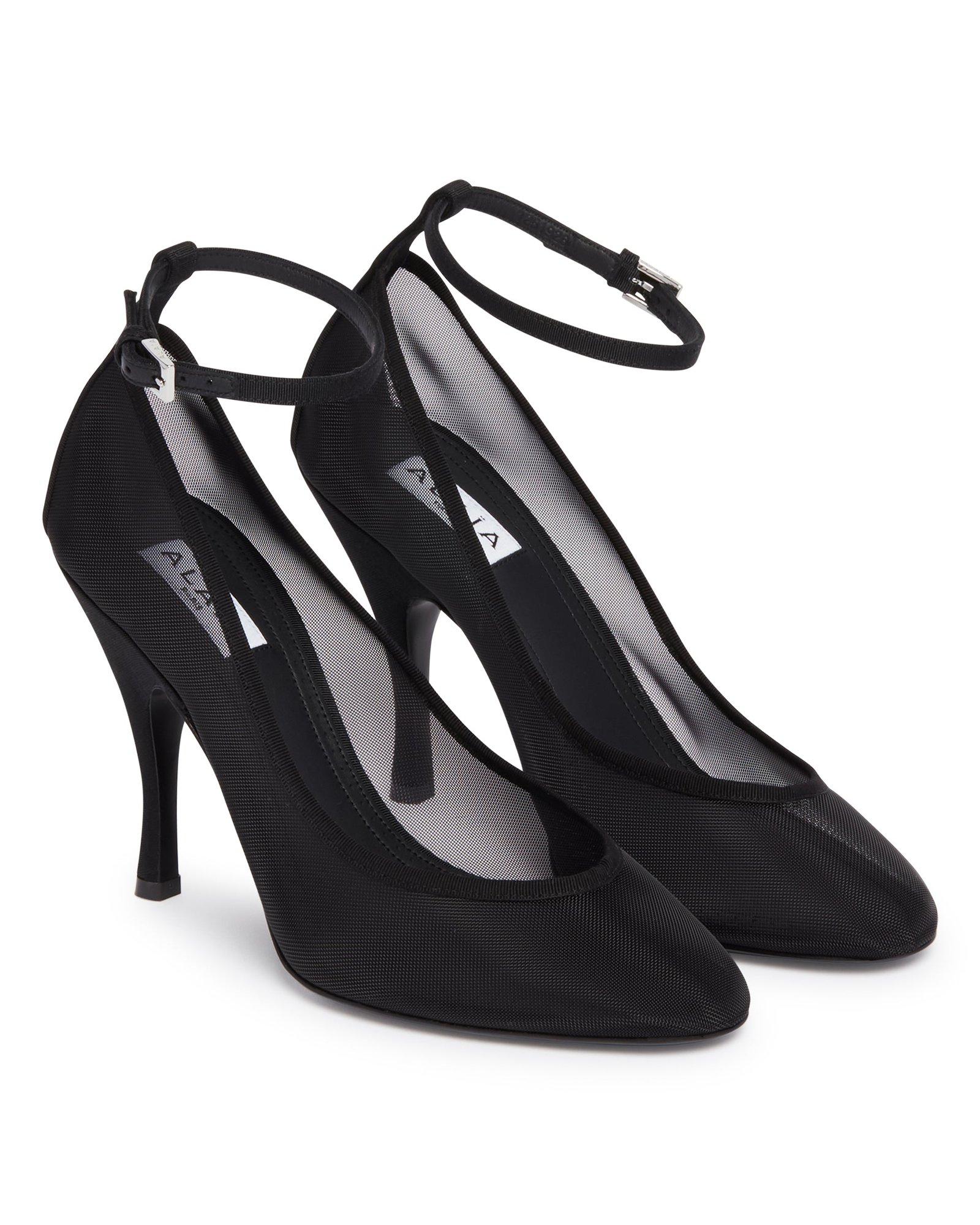 Black mesh ankle-strap pumps showing transparent uppers
