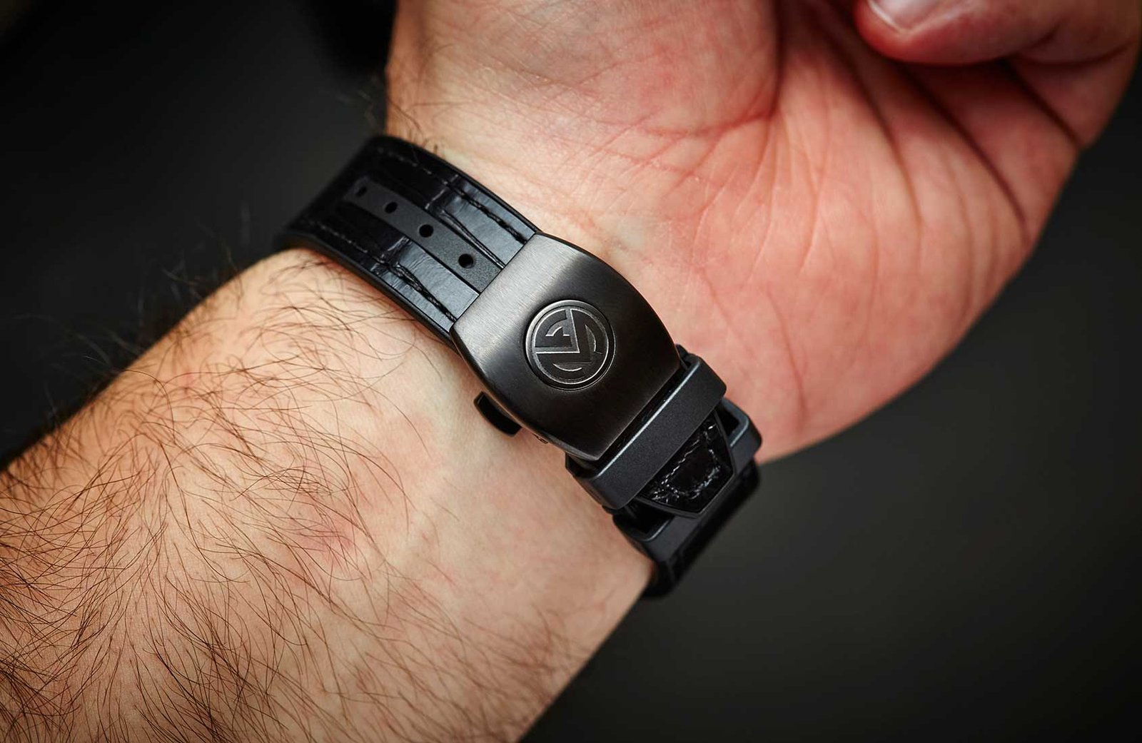 The underside of a Vanguard strap and clasp shown on the wrist.