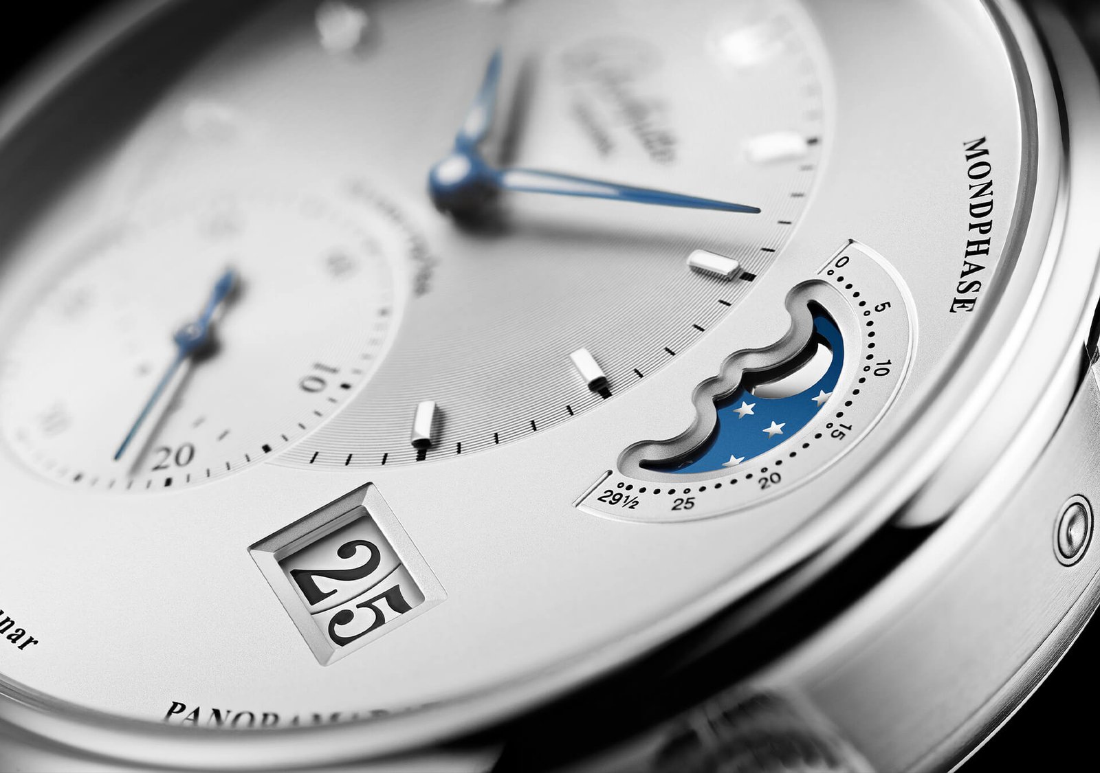 Detailed view of the PanoMaticLunar’s silver dial and blue moon-phase display.