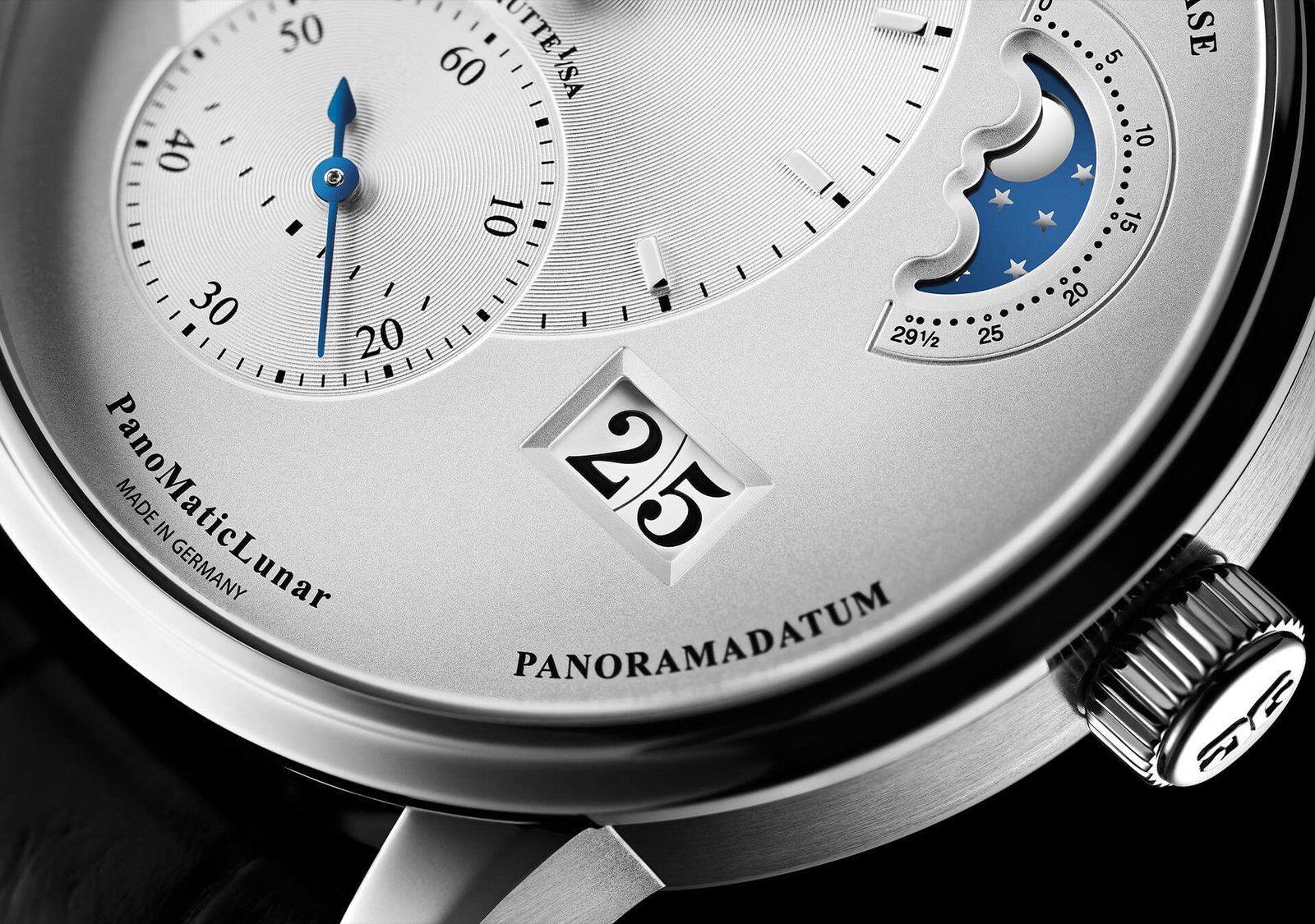 Close-up of the PanoMaticLunar’s asymmetric silver dial, moon phase and Panorama Date.