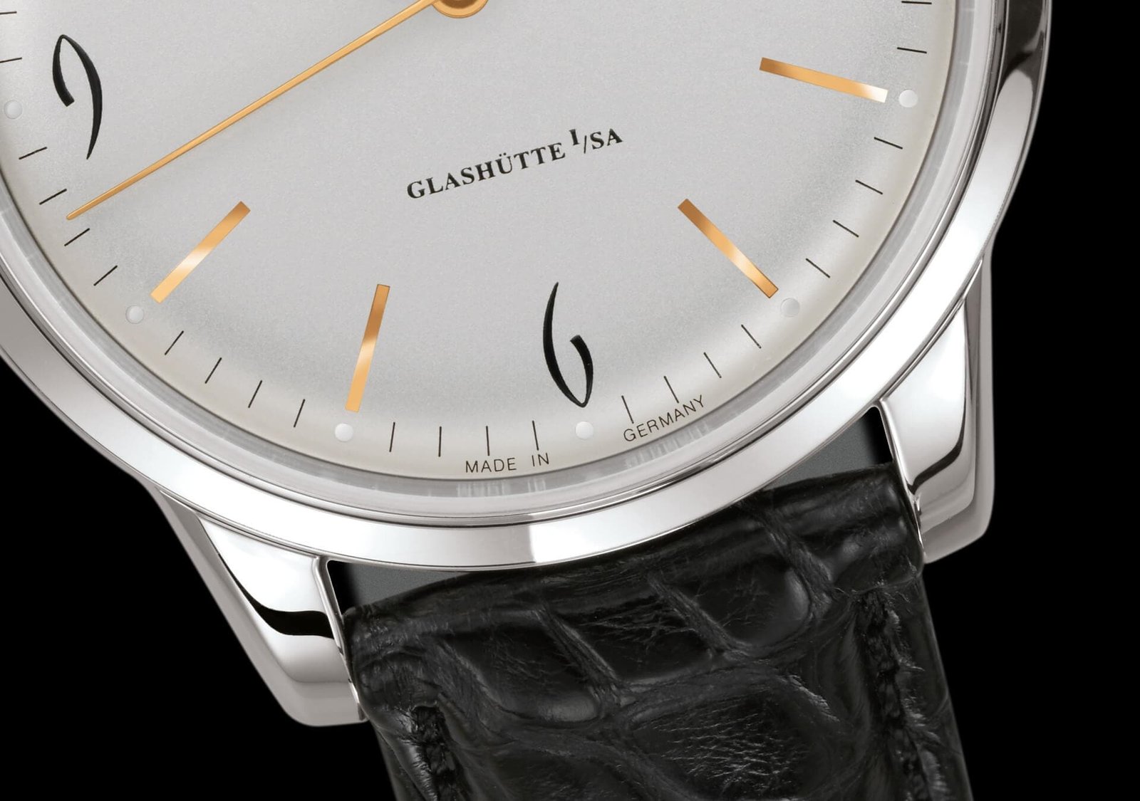 Close-up of the Sixties’ domed silver dial, golden hands and polished steel case.