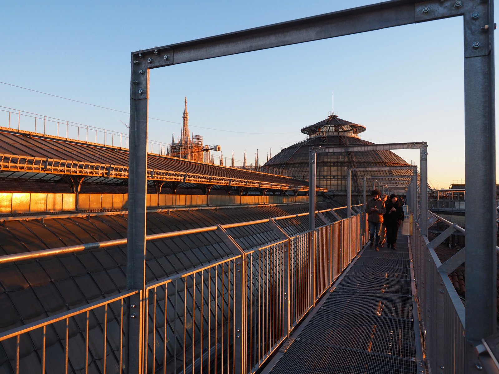 HIGHLINE rooftop walkway beside the Galleria’s glass dome at sunset.