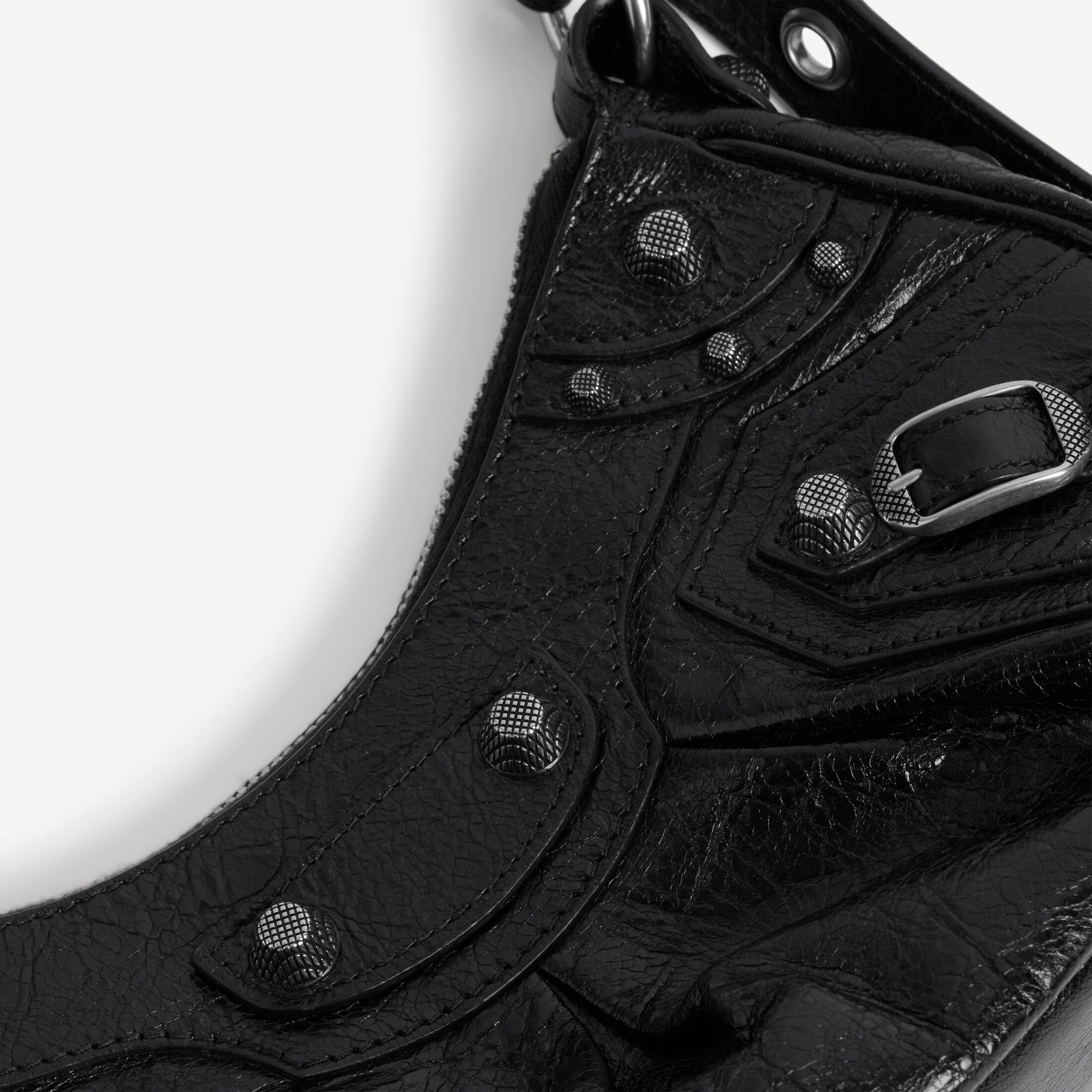 Close-up of black Arena lambskin and aged-silver fittings on the Le Cagole XS.