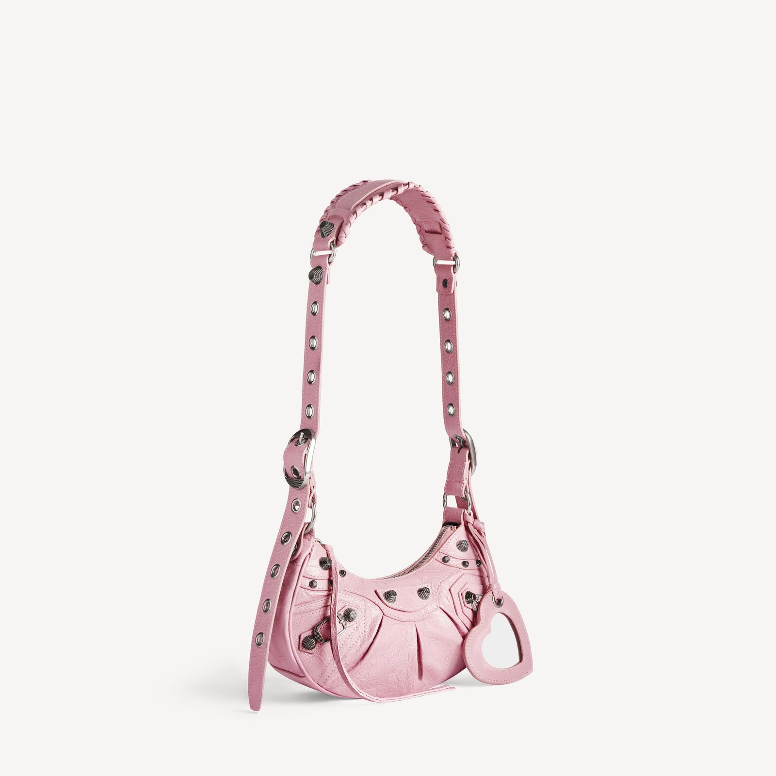 Light pink Le Cagole XS showing its curved body and aged-silver fittings.