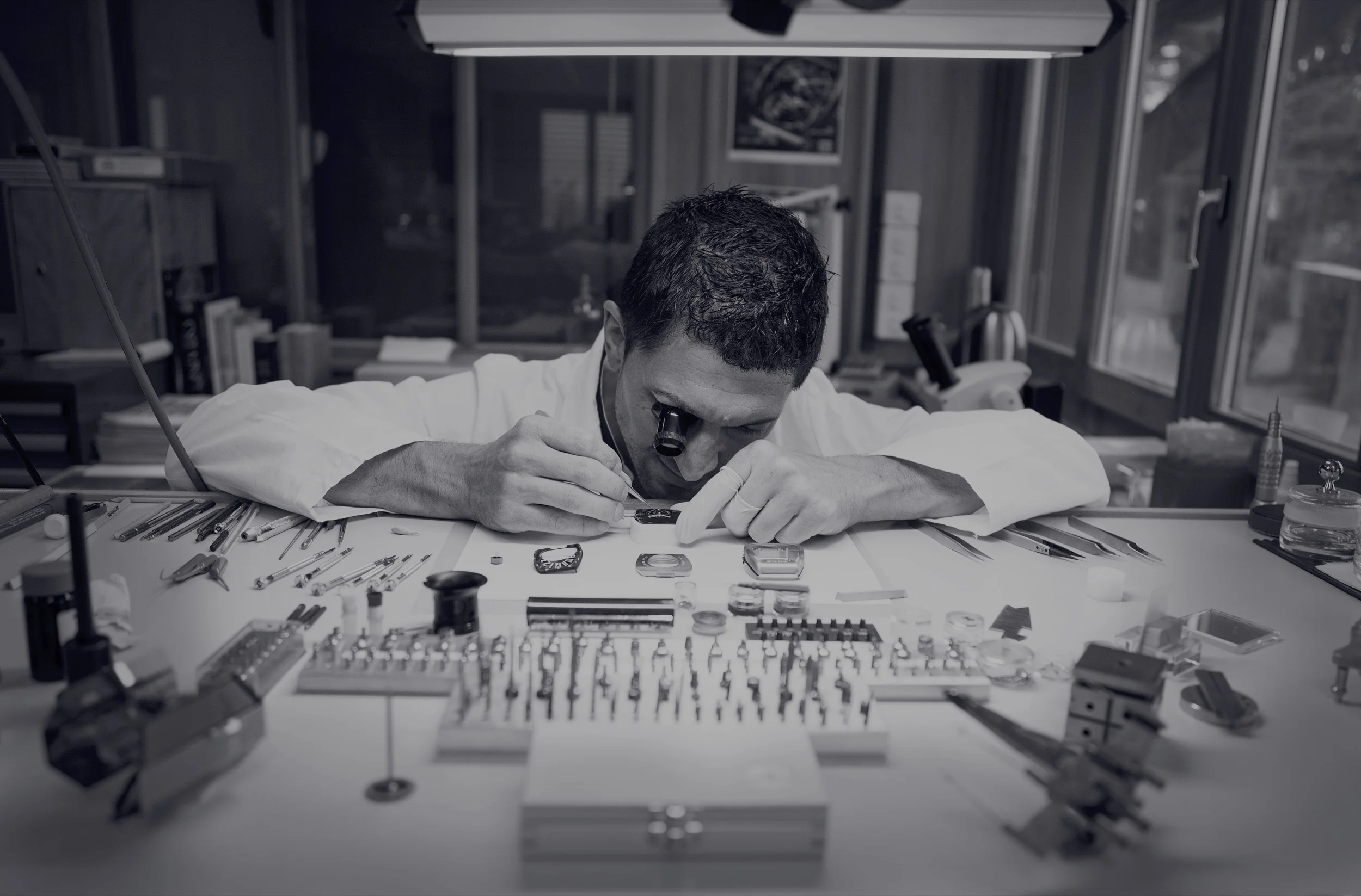 Franck Muller watchmaker working at a watchmaking bench.