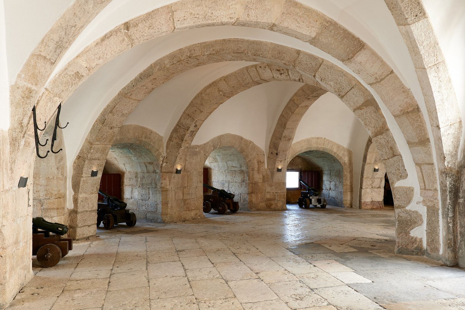 Vaulted stone hall inside Belém Tower.