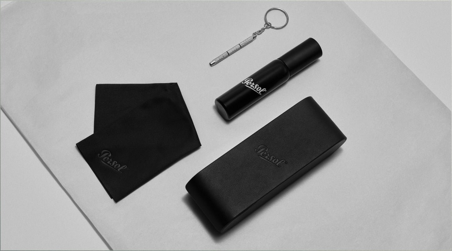 Persol eyewear care kit with lens cloth, cleaning spray and adjustment tool.