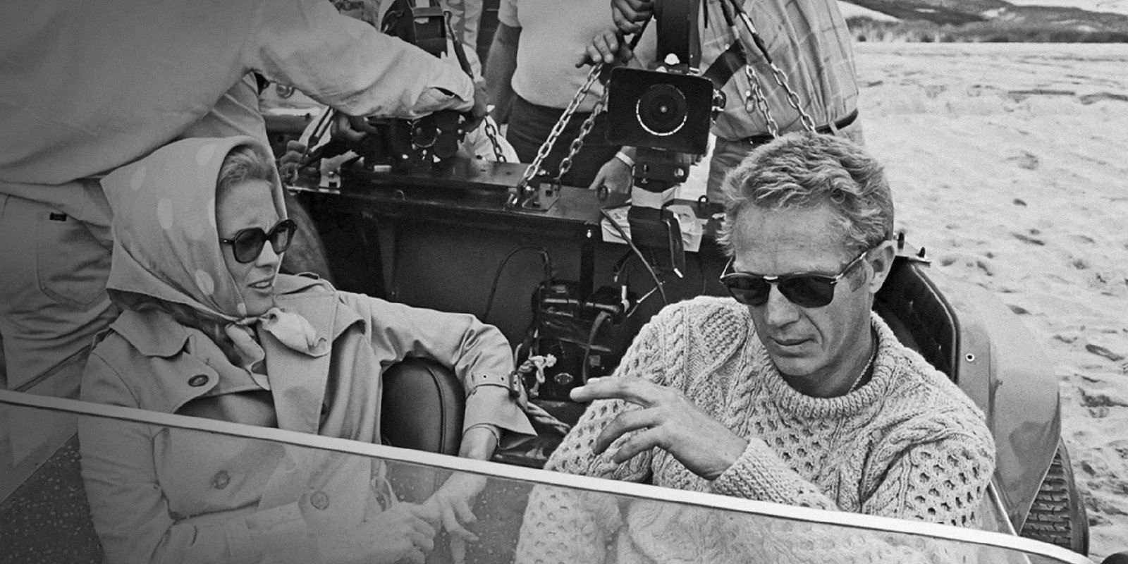 Archival photograph of Steve McQueen wearing Persol sunglasses with a textured knit sweater.