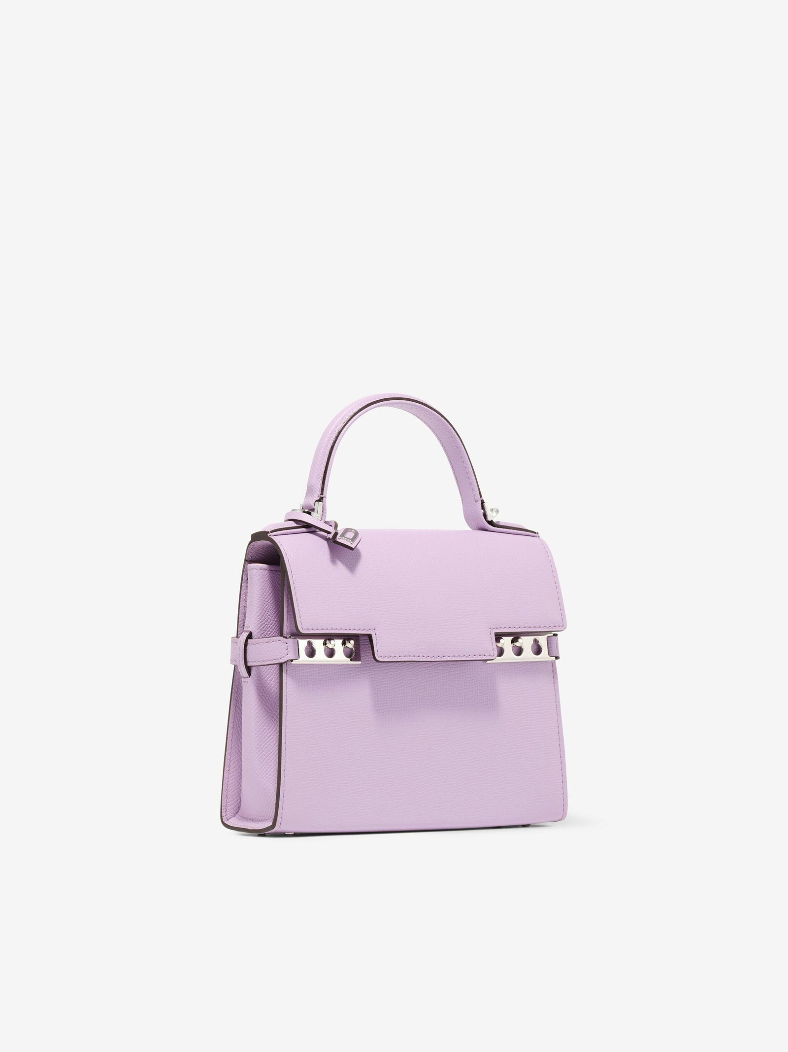 Pale pink Delvaux Tempête Small showing its architectural clasp and top handle.
