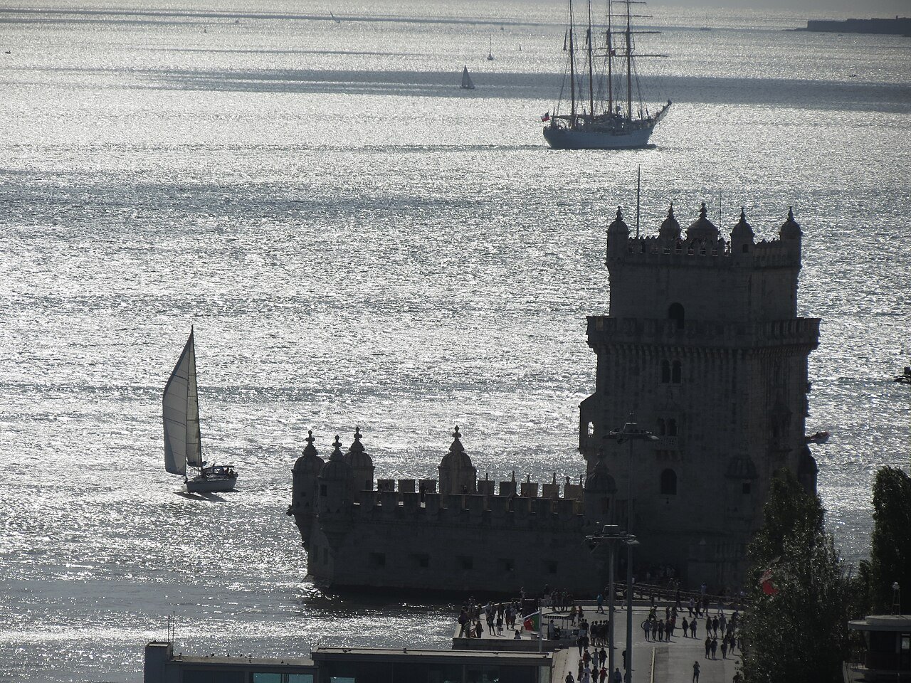Belém Tower beside the Tagus at sunset.
