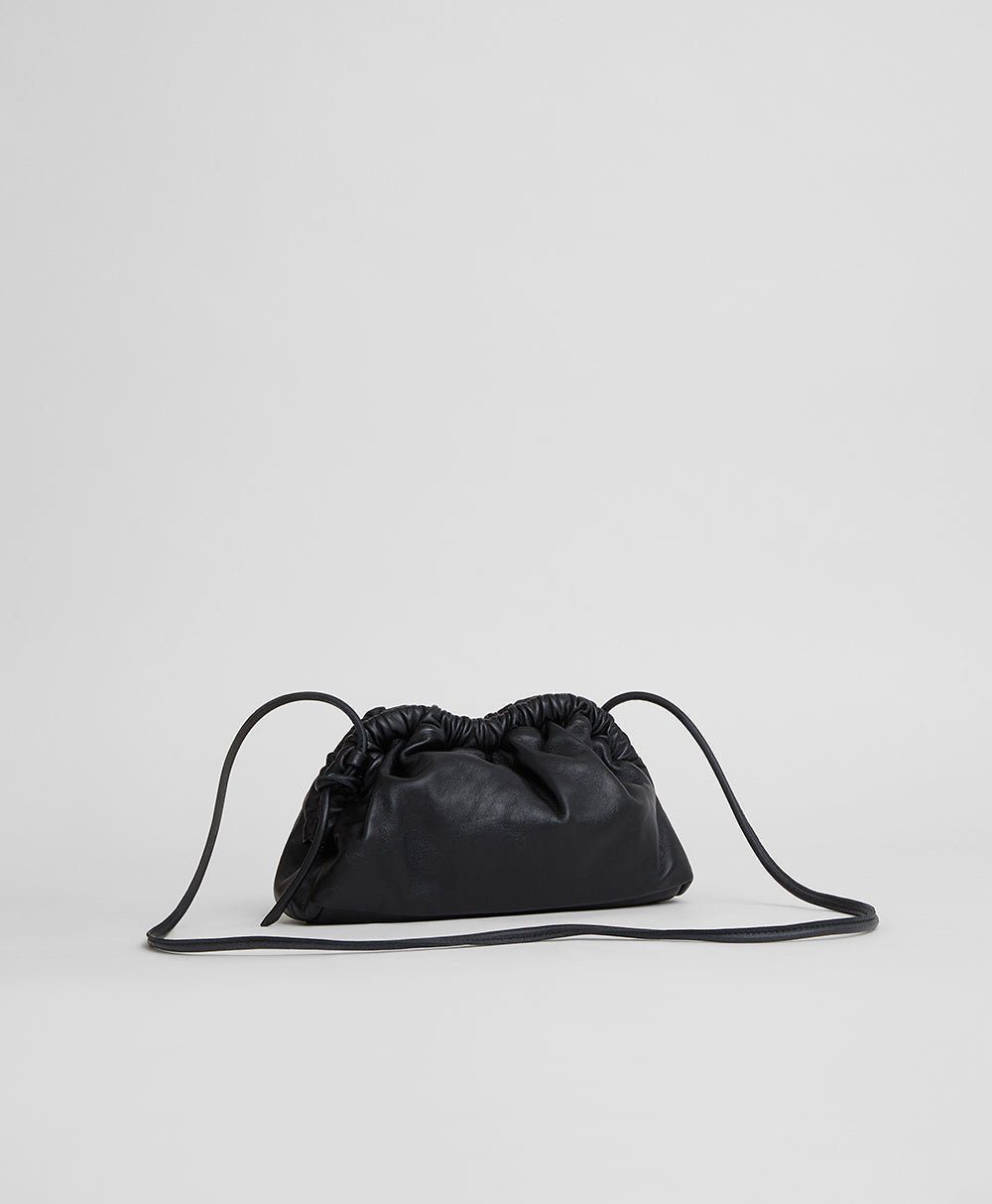 Black Mini Cloud Clutch with its long leather strap extended
