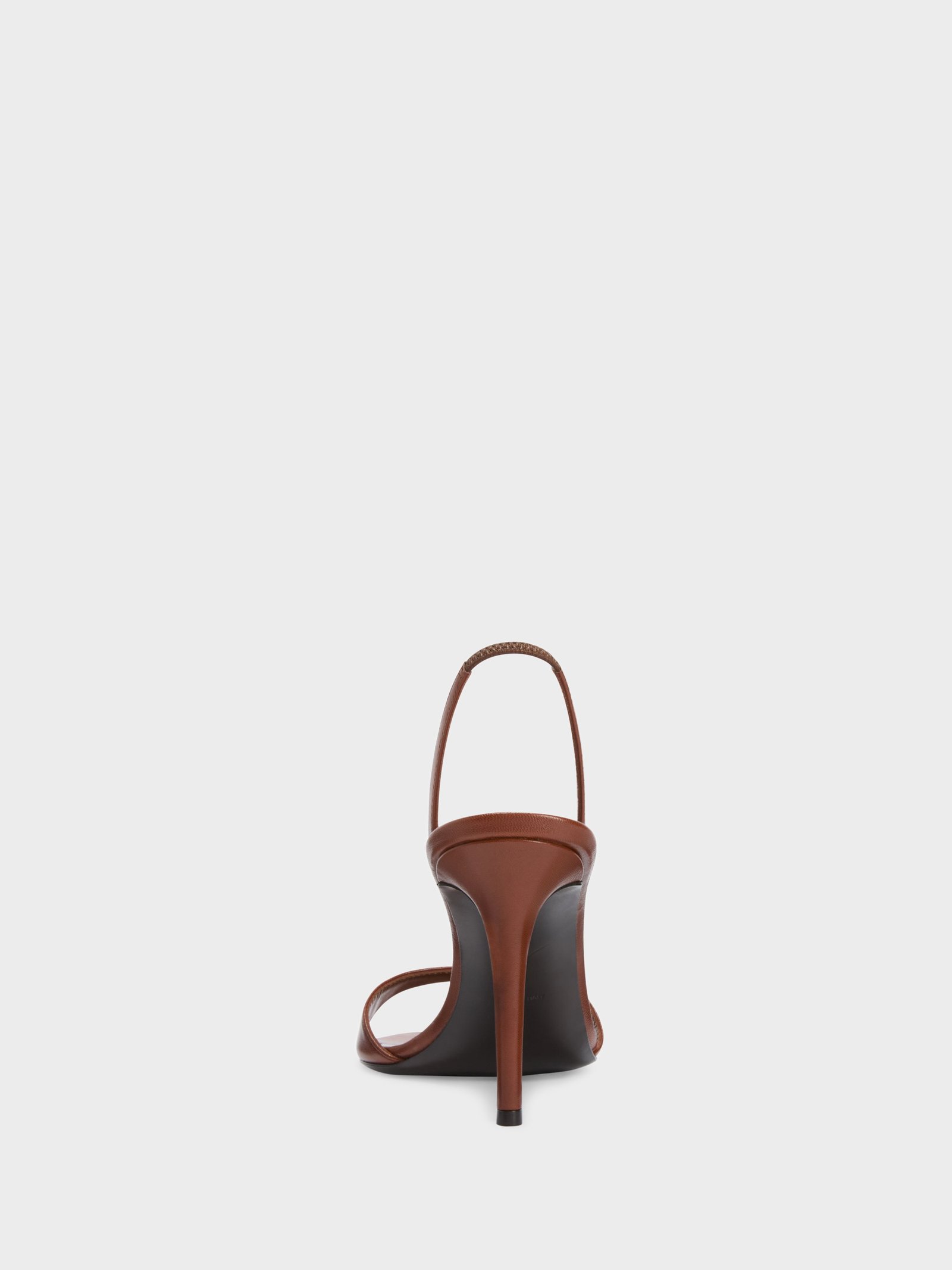 Rear view of Giuseppe Zanotti Lilibeth sandals showing their heels and elastic straps.