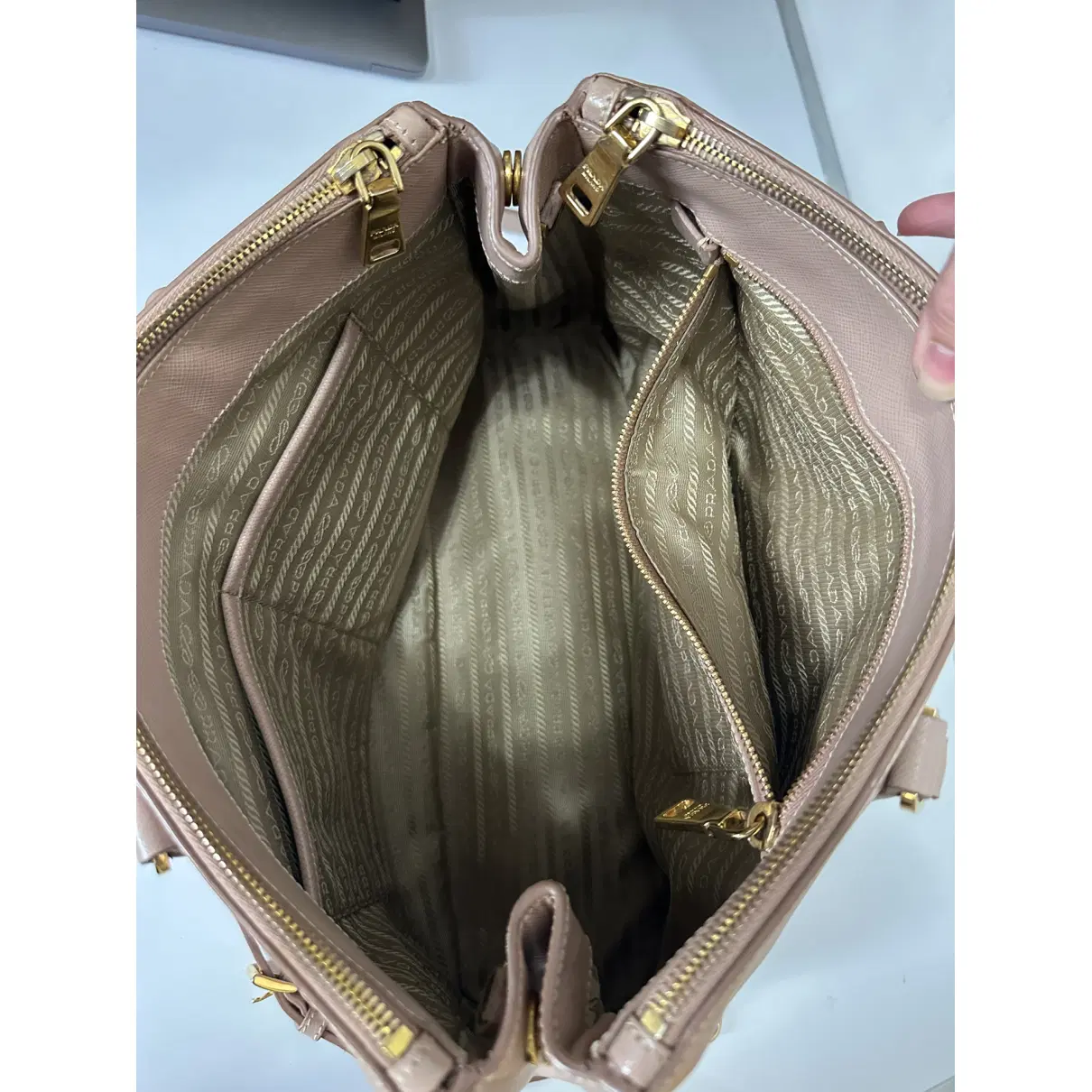 Open Prada Galleria bag showing its depth, compartments and interior pockets.