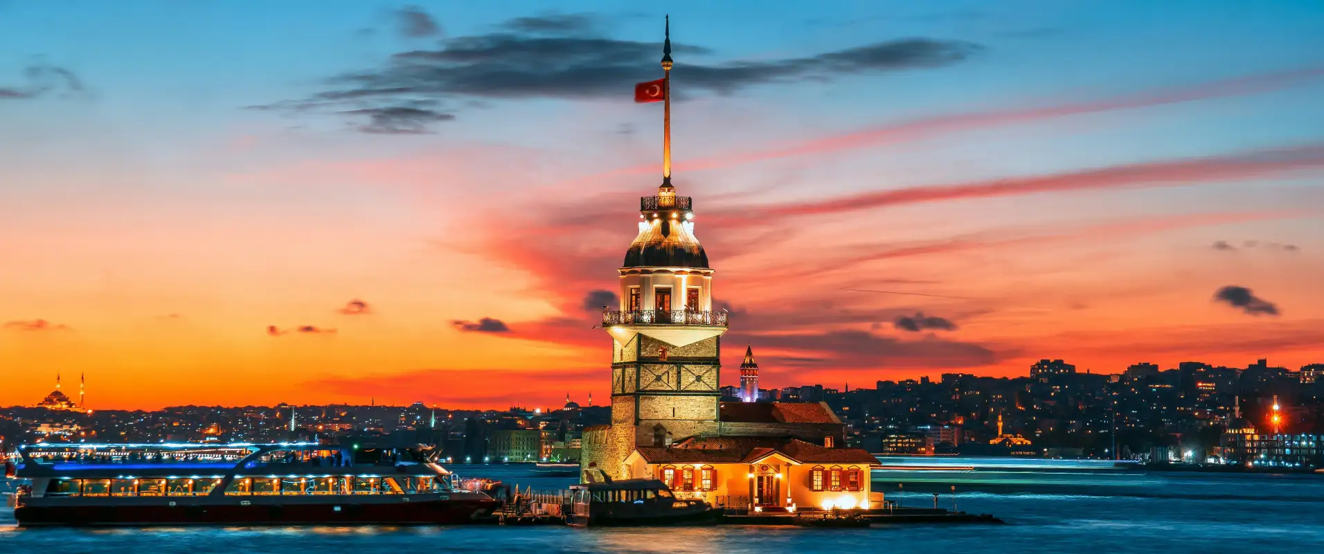 Maiden’s Tower in the Bosphorus against a warm evening sky.