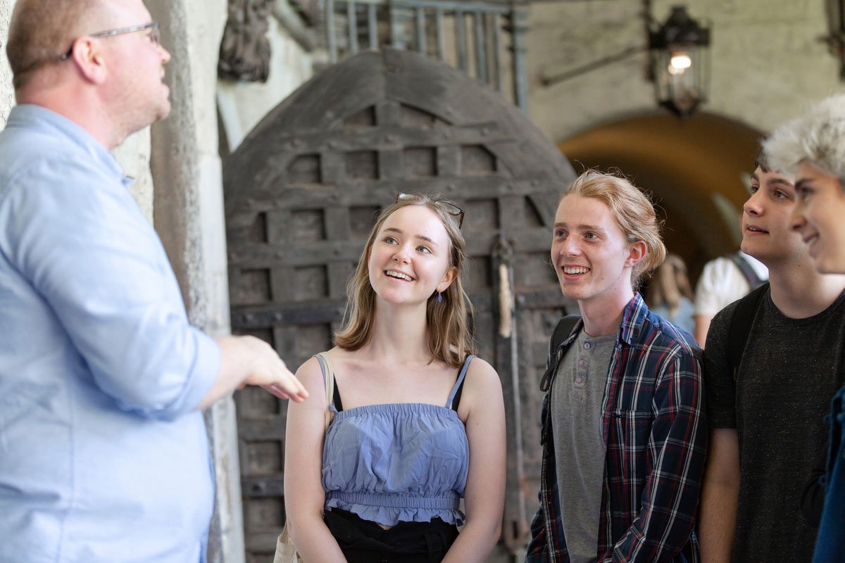 Visitors listening to a guide at Westminster Abbey.