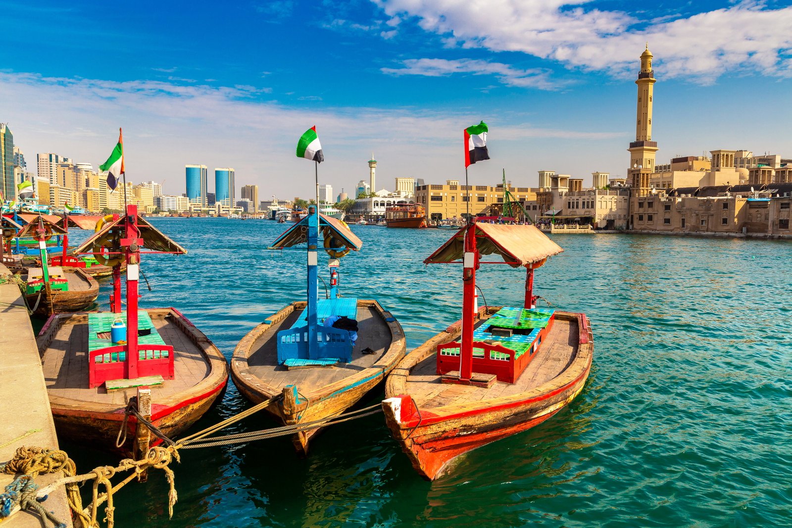 Traditional abras moored beside a Dubai Creek station