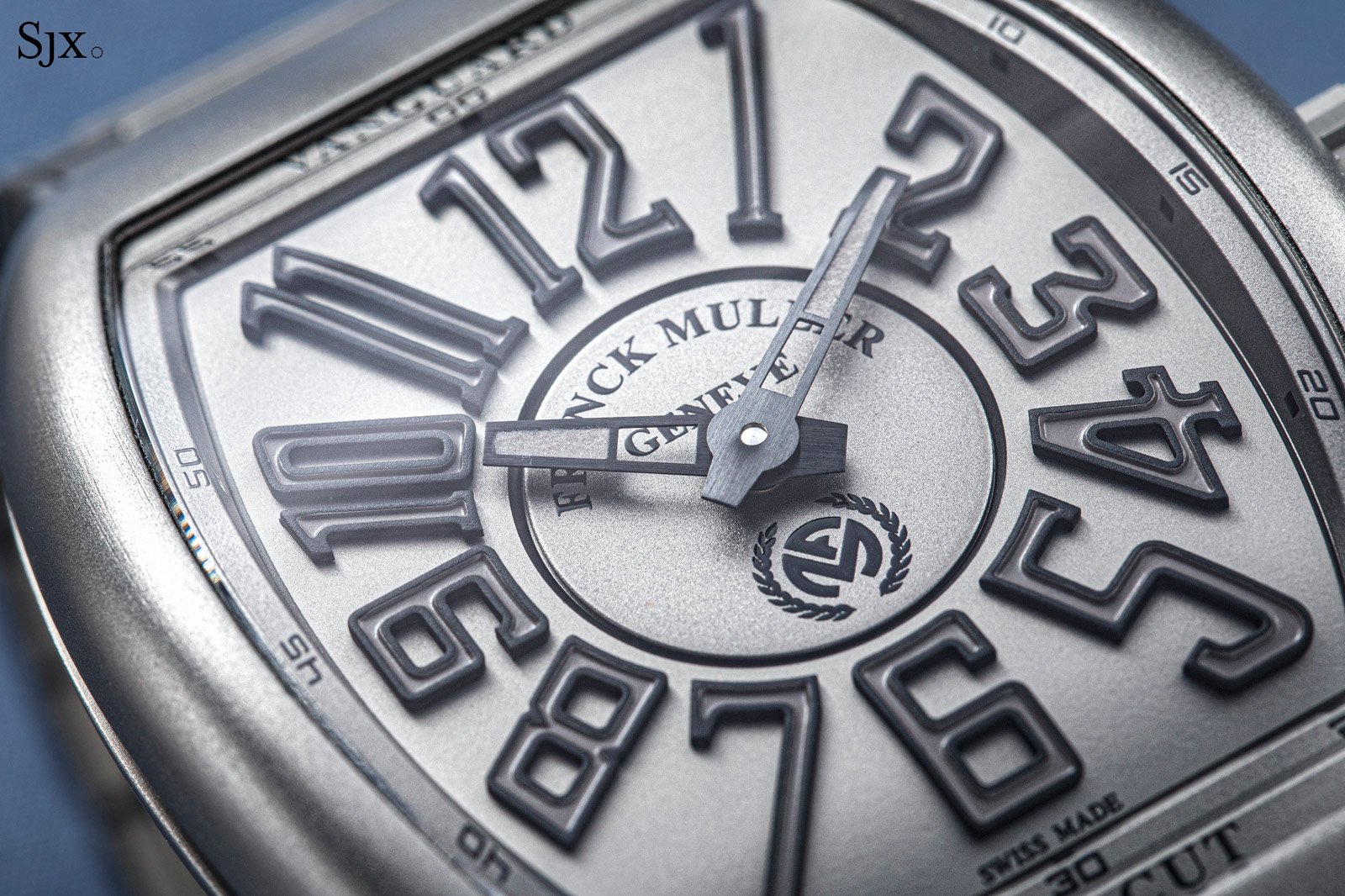 Close-up of the textured dial and raised numerals of a Vanguard Line Cut.